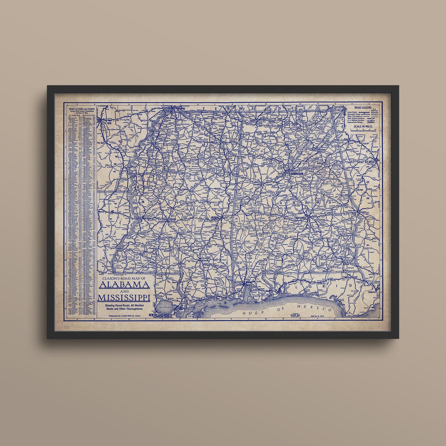 The image is a framed vintage map of Alabama, showing the state's roads and highways in blue and white.