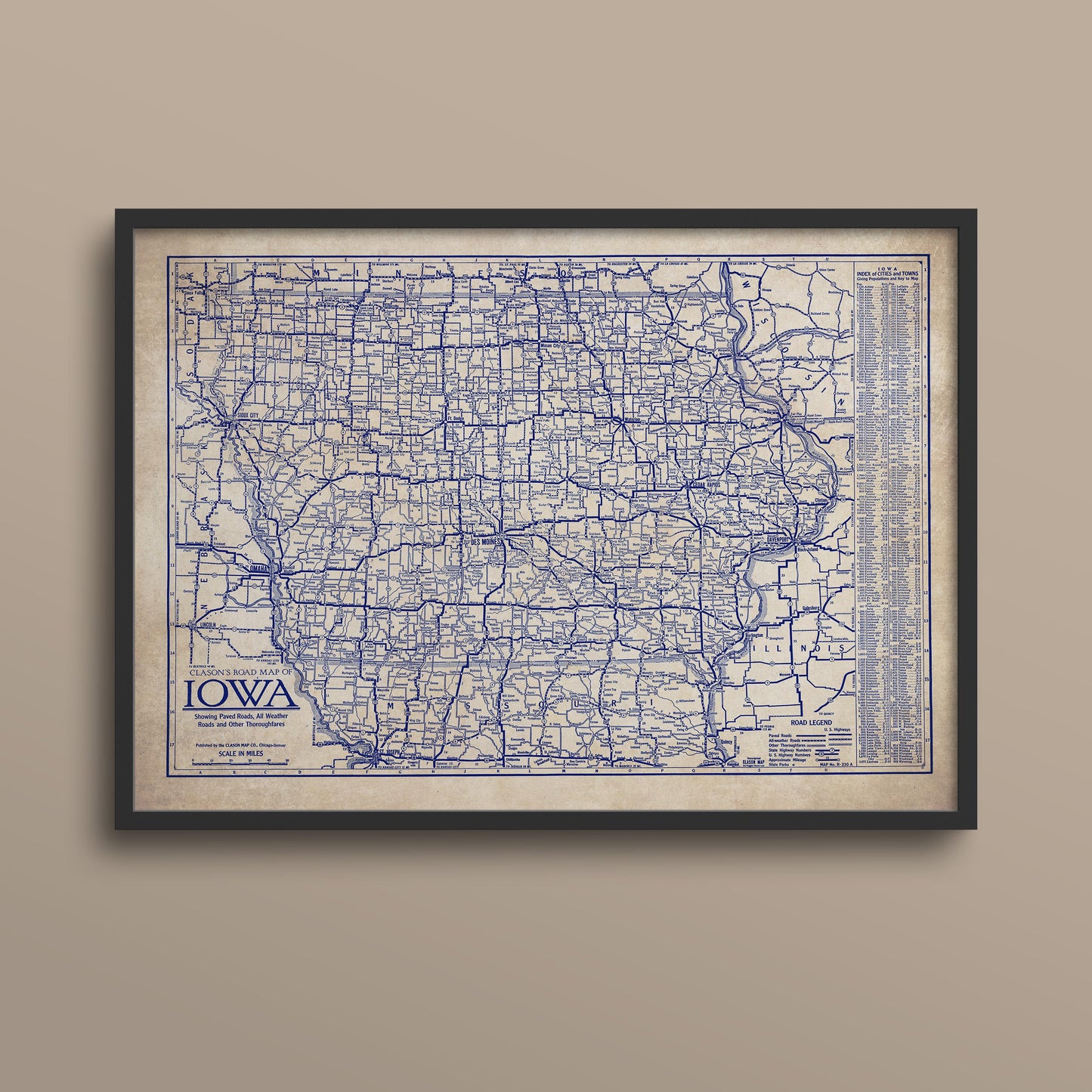 The image is a framed vintage map of Iowa, showing the state's roads and highways in a detailed and detailed manner.