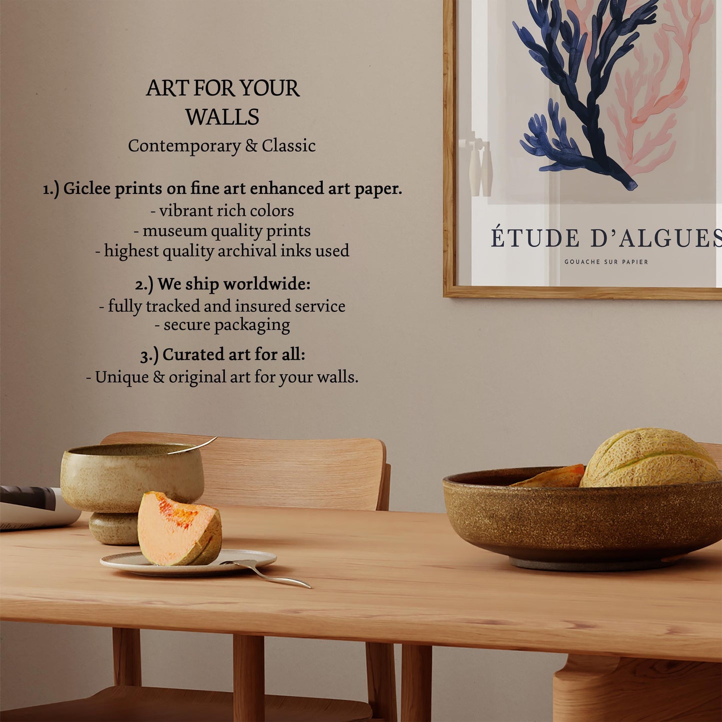 a wooden dining table with a bowl of fruit, a plate with a slice of fruit, and a framed poster on the wall.