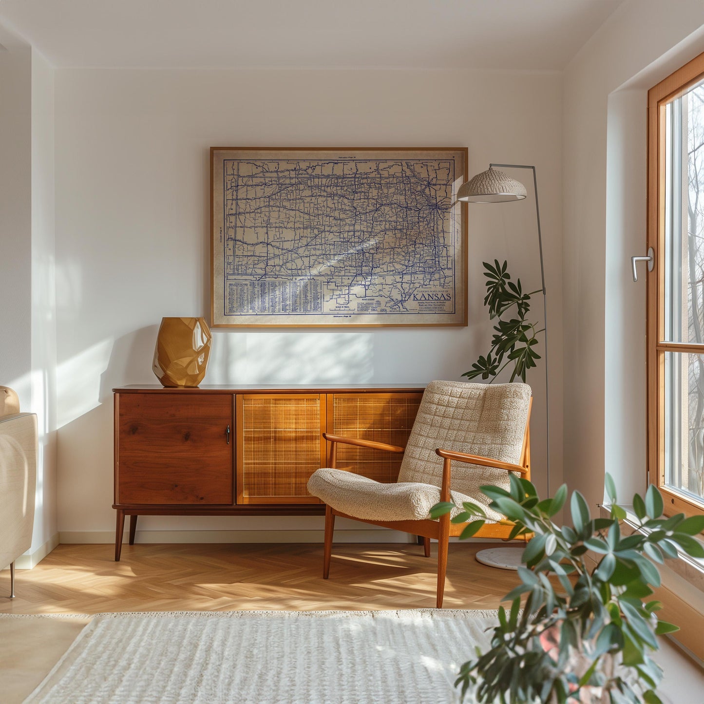 a cozy living room with a wooden cabinet, a comfortable armchair, and a large map on the wall. The room is illuminated by natural light from a window, and there are potted plants and a rug adding to the warm and inviting atmosphere.