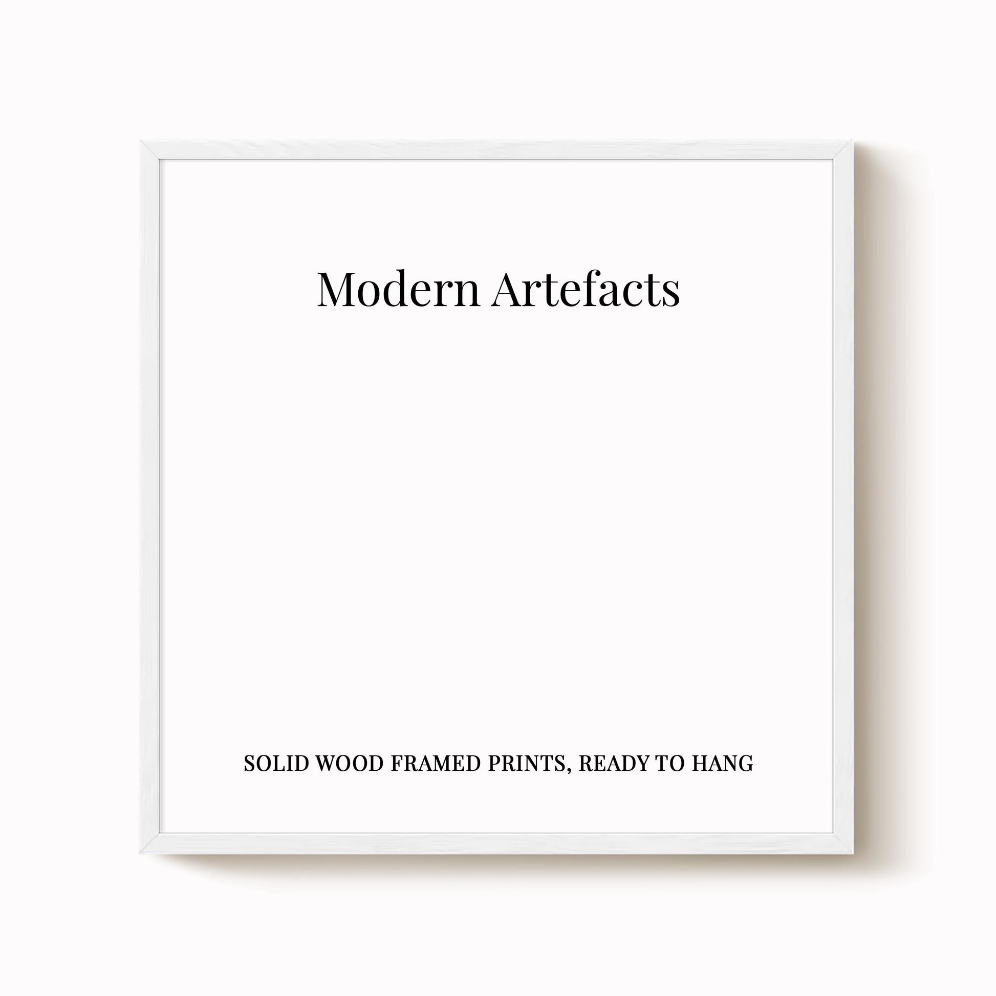 The image is a white square frame with the text "Modern Artifacts" and "Solid wood framed prints, ready to hang" written on it.