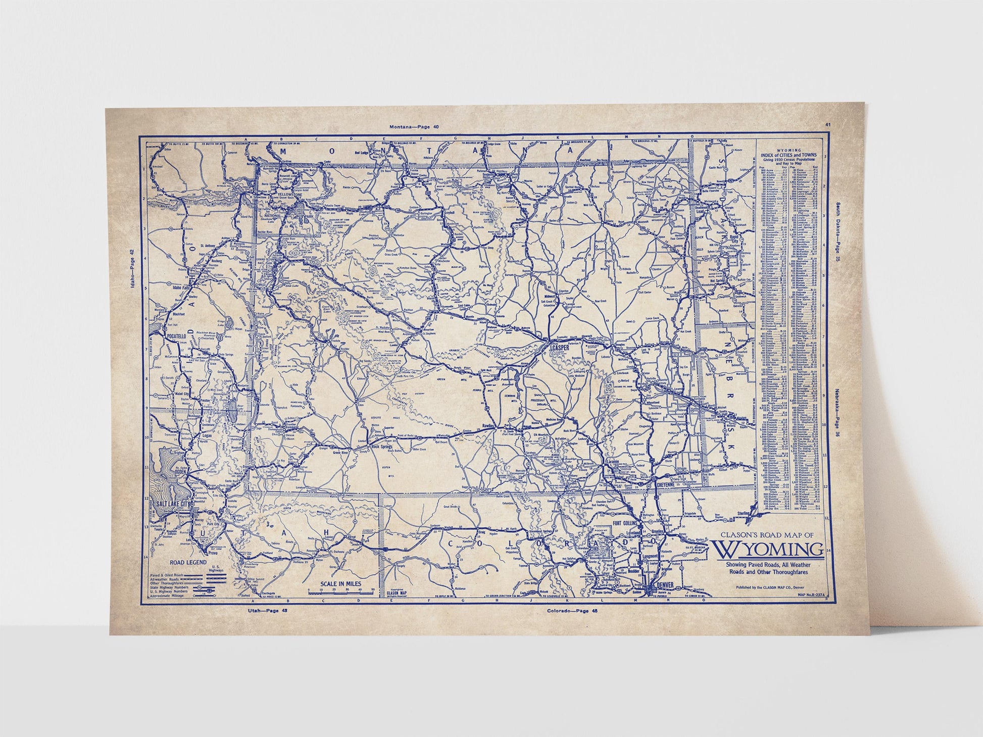 The image is a vintage map of Wyoming, depicting the state's roads and highways in a detailed and intricate manner.