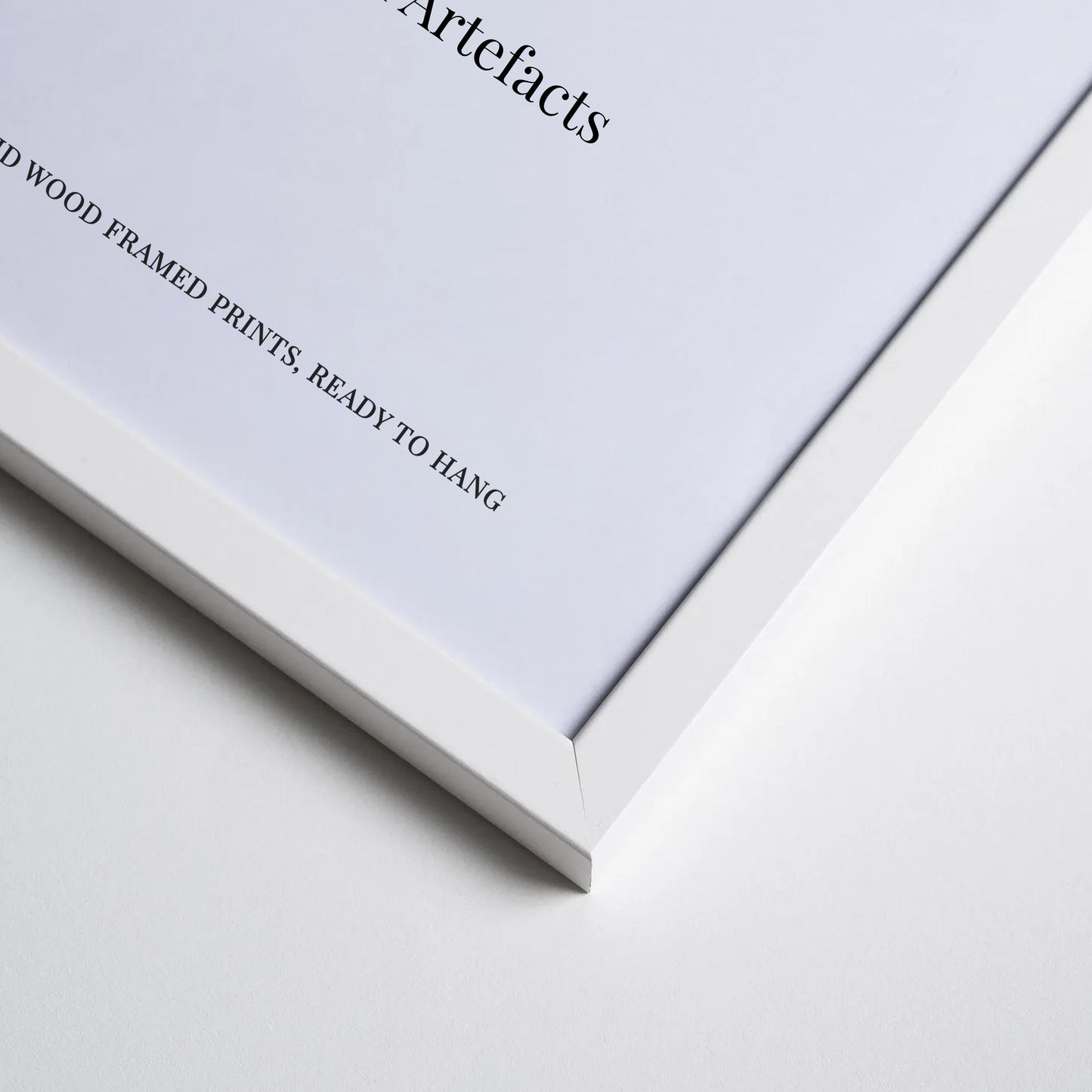 The image is a close-up of a white framed print with text on the left side.