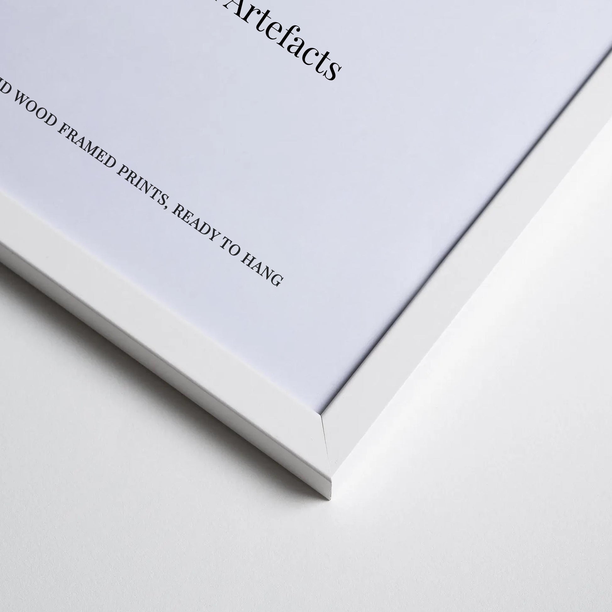 The image is a close-up of a white framed print with text on the left side.
