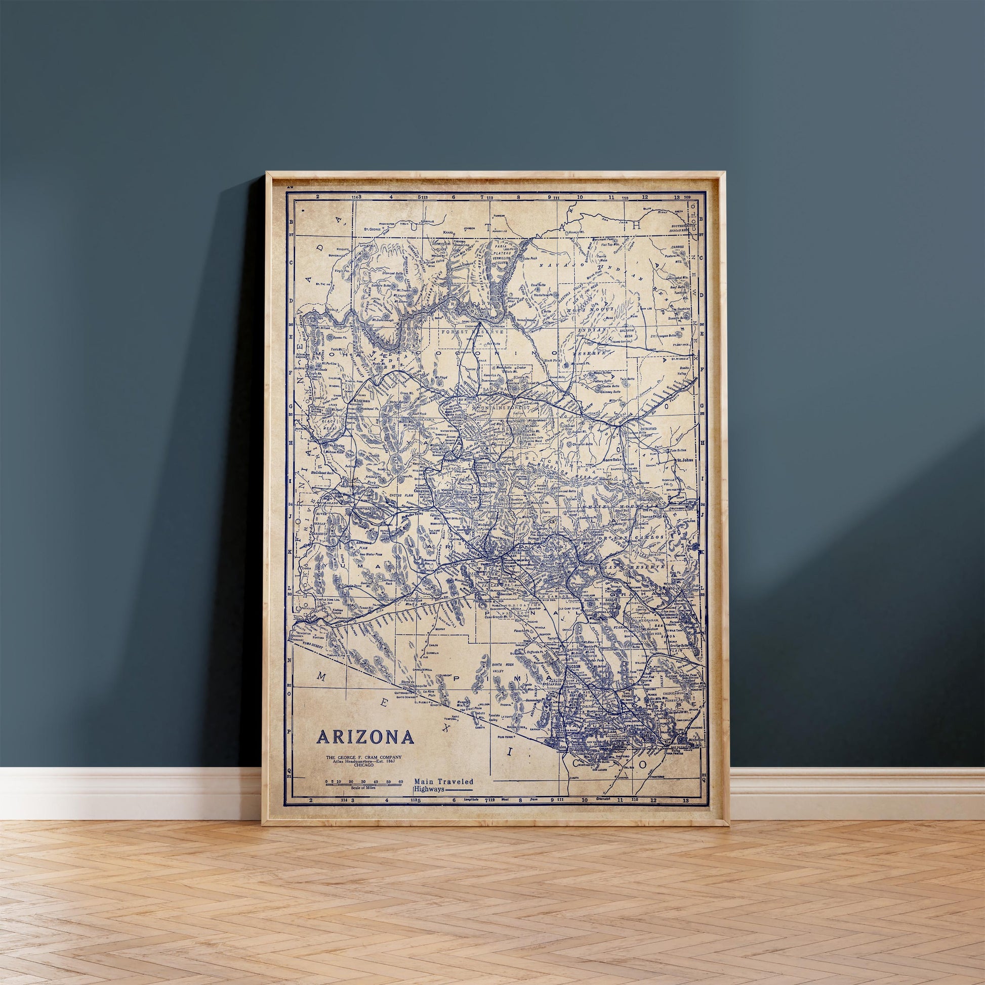 a framed map of Arizona, with the state's borders and major cities clearly visible.