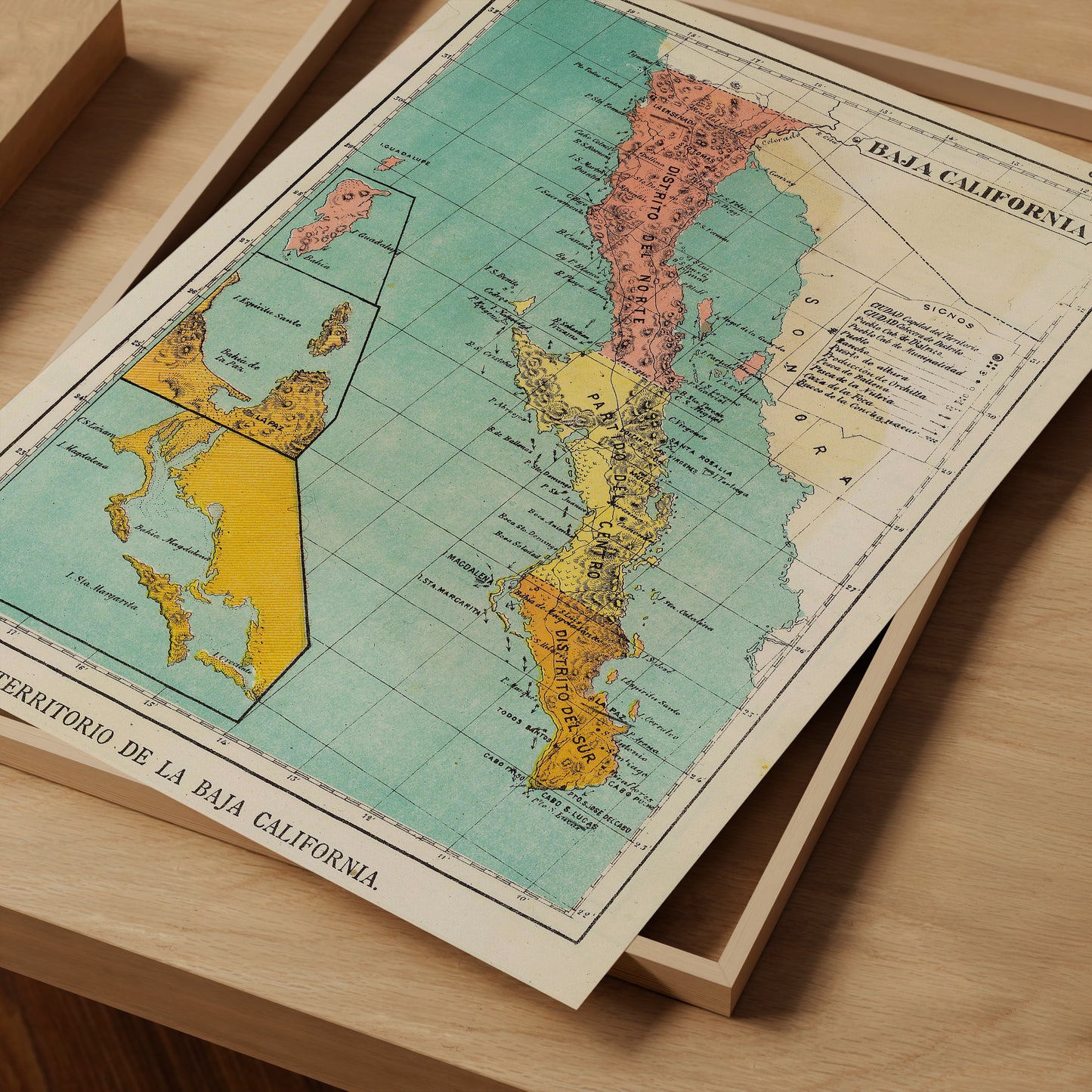 The image is a vintage map of the Baja California region, featuring a colorful and detailed representation of the area.
