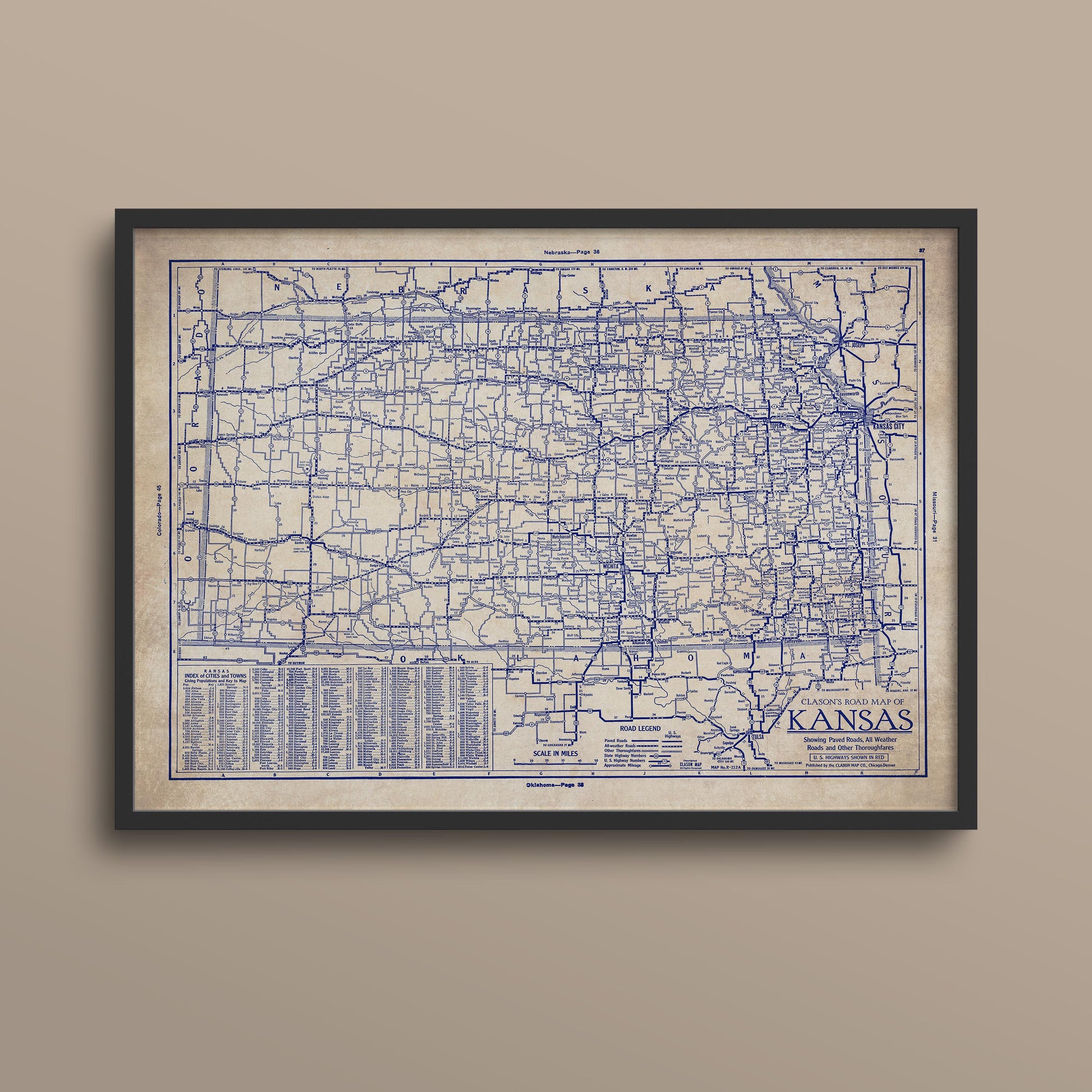 The image is a framed vintage map of Kansas, showing the state's roads and highways in a detailed and intricate manner.