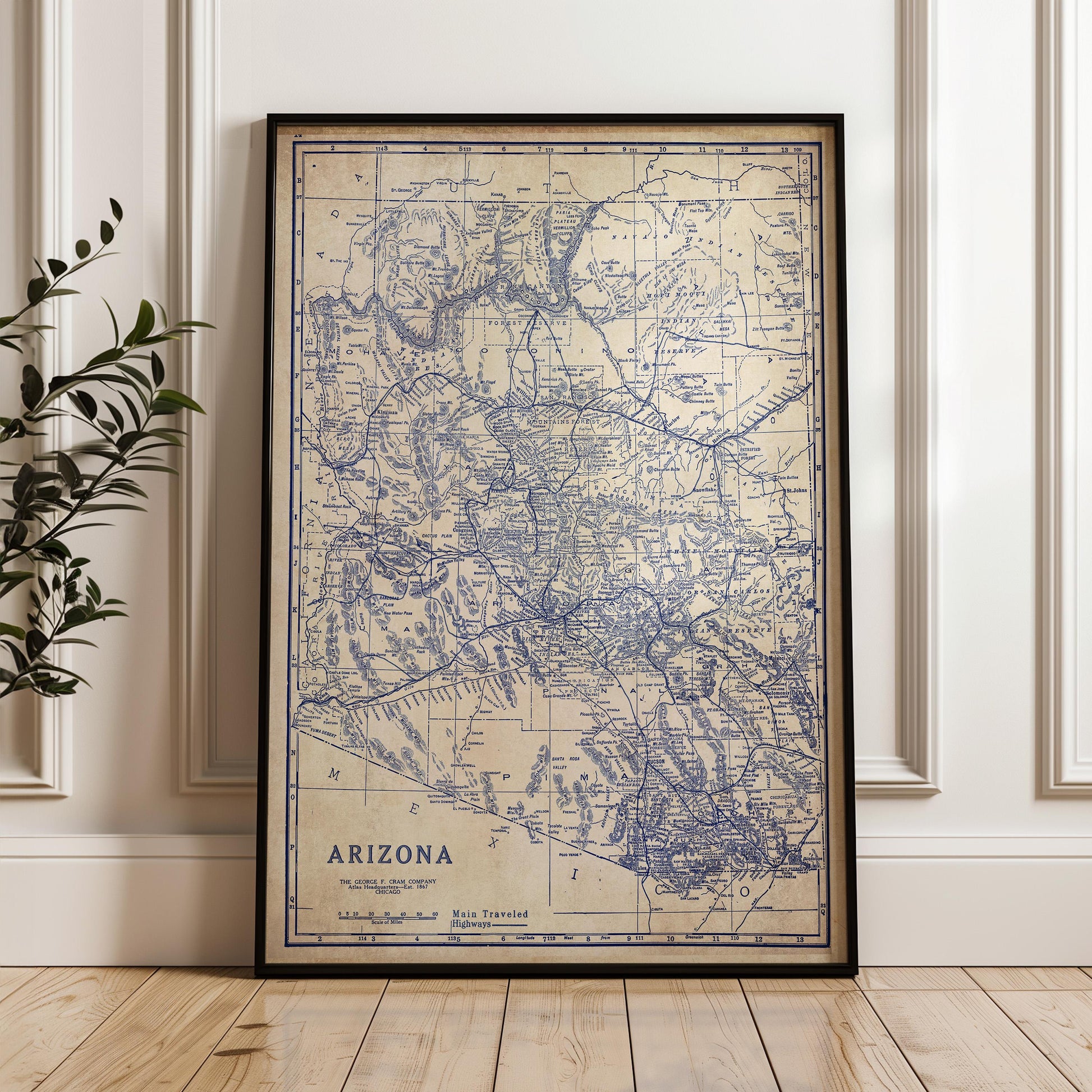 a framed map of Arizona, with the state's borders and major cities clearly visible.