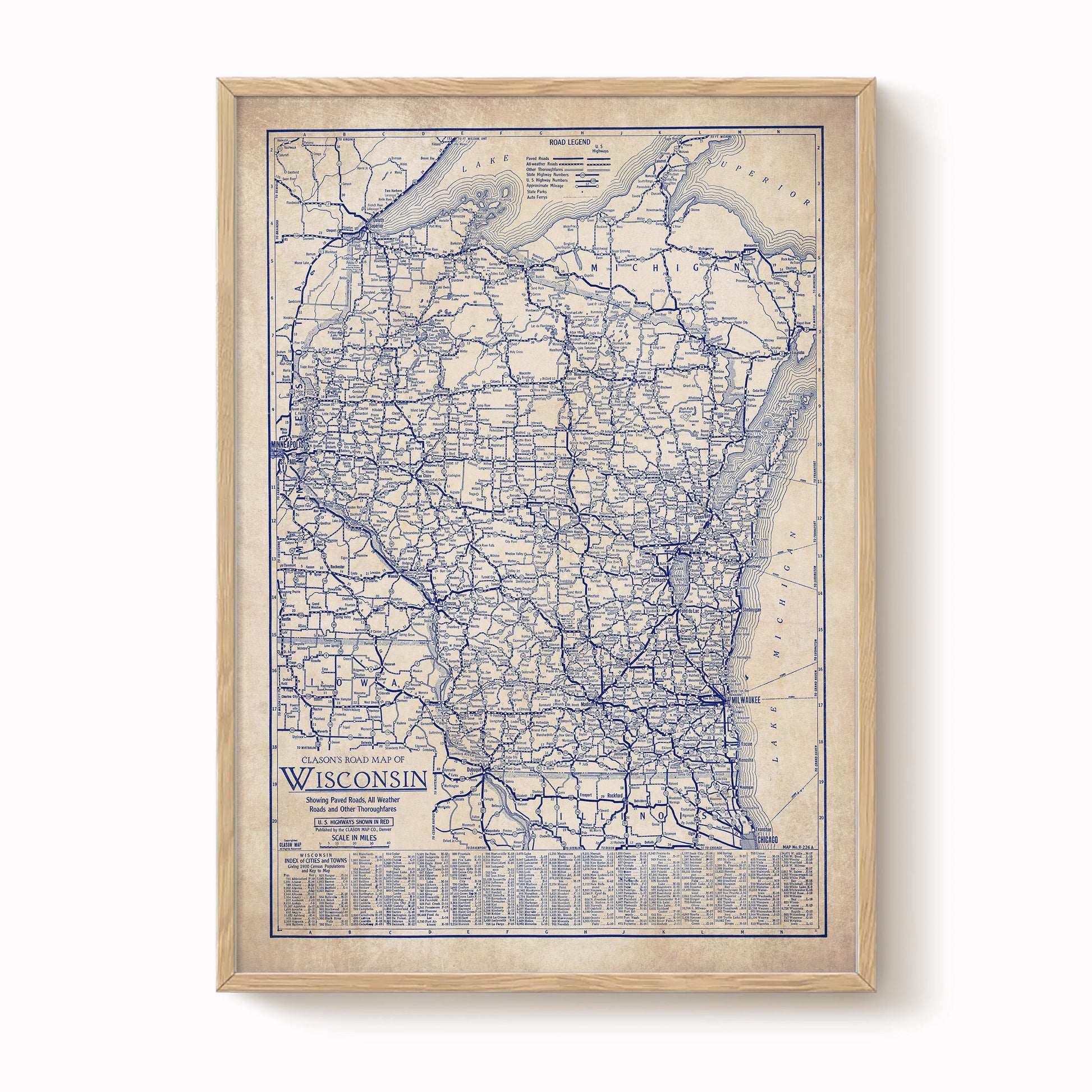 The image is a framed vintage map of Wisconsin, showing the state's roads and highways in blue.