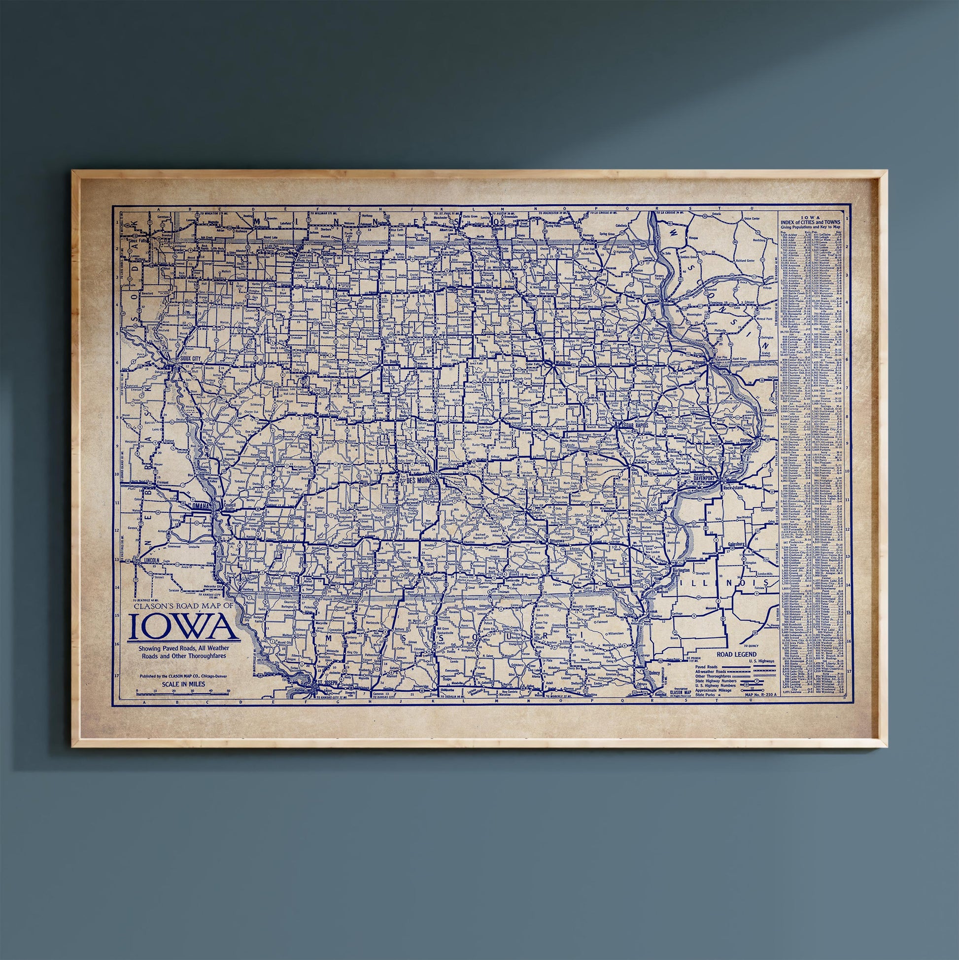 The image is a framed map of Iowa, showing the state's roads and highways in a detailed and comprehensive manner.