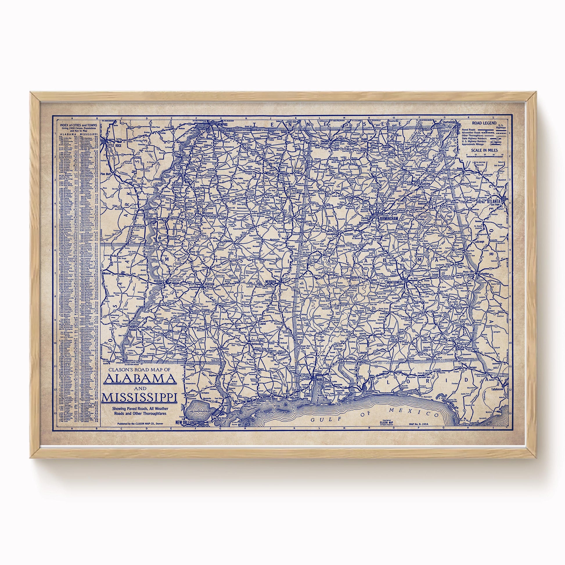 The image is a framed vintage map of Alabama, showing the state's roads and highways in blue and white.