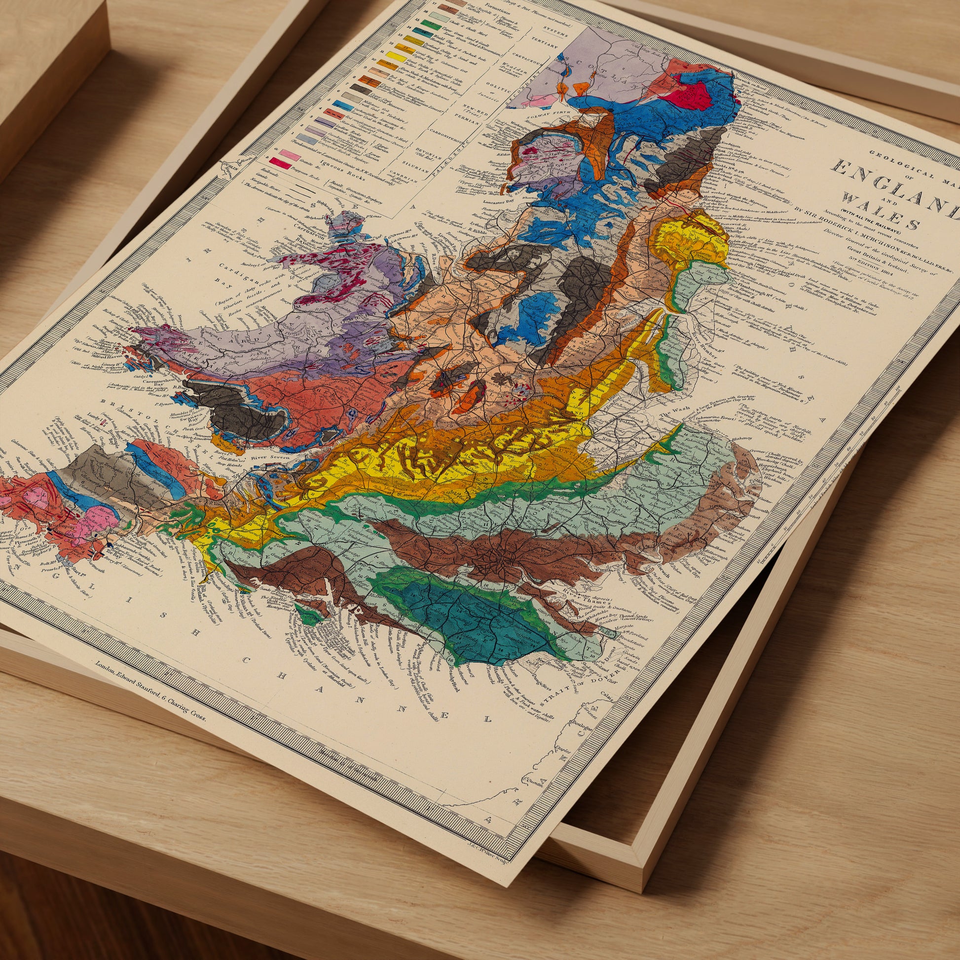 The image is a vintage geological map of England and Wales, featuring a detailed and colorful depiction of the region's geological features.