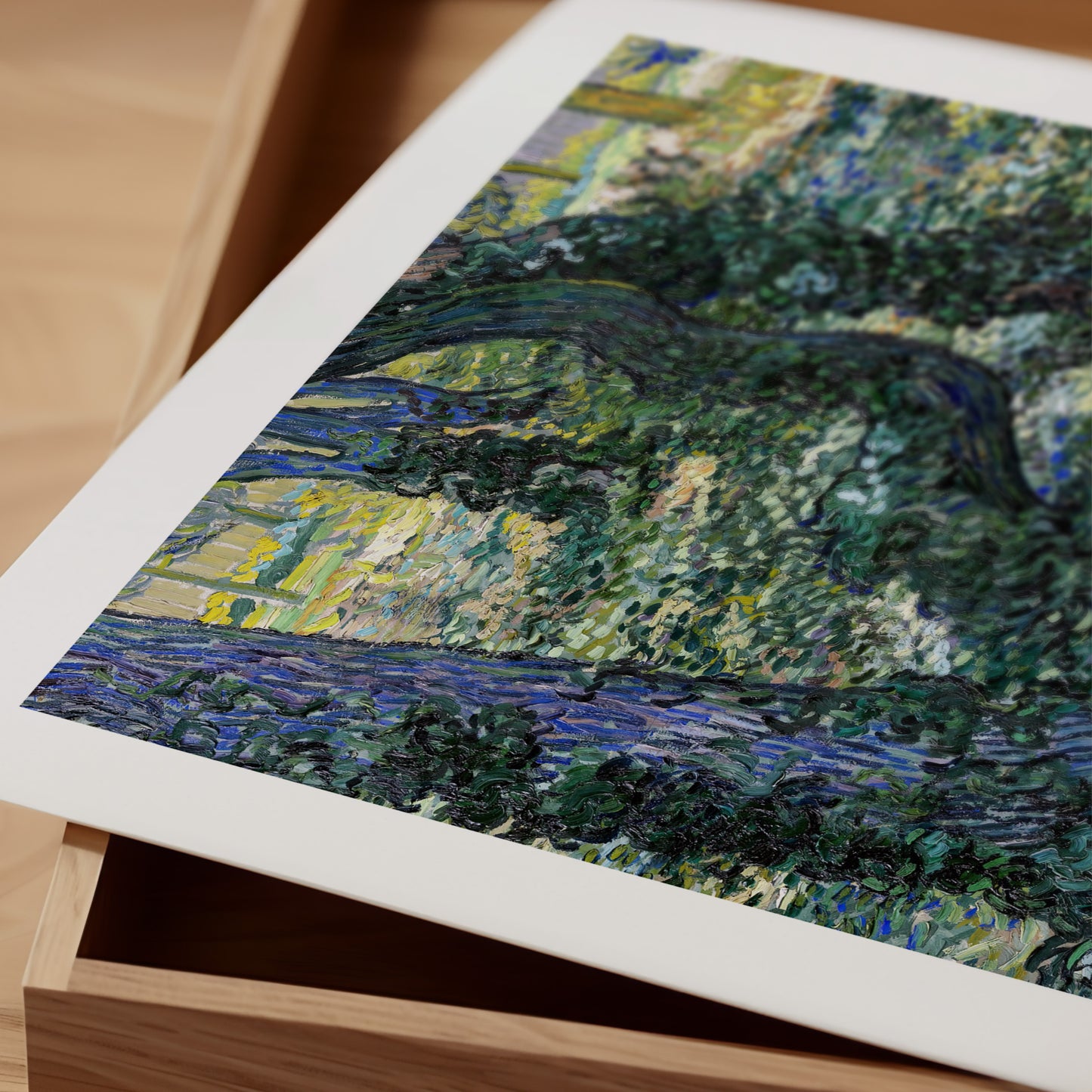 The image is a close-up of a painting depicting a lush, green landscape with a river or stream running through it.
