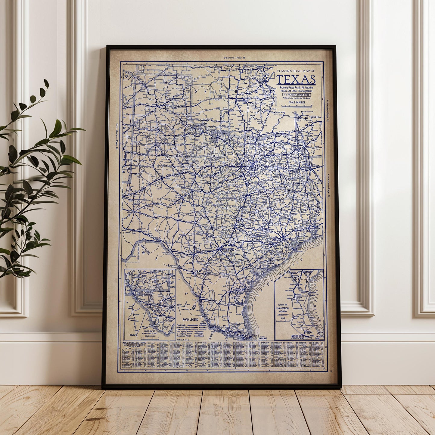 a framed vintage map of Texas, with detailed road networks and labels.