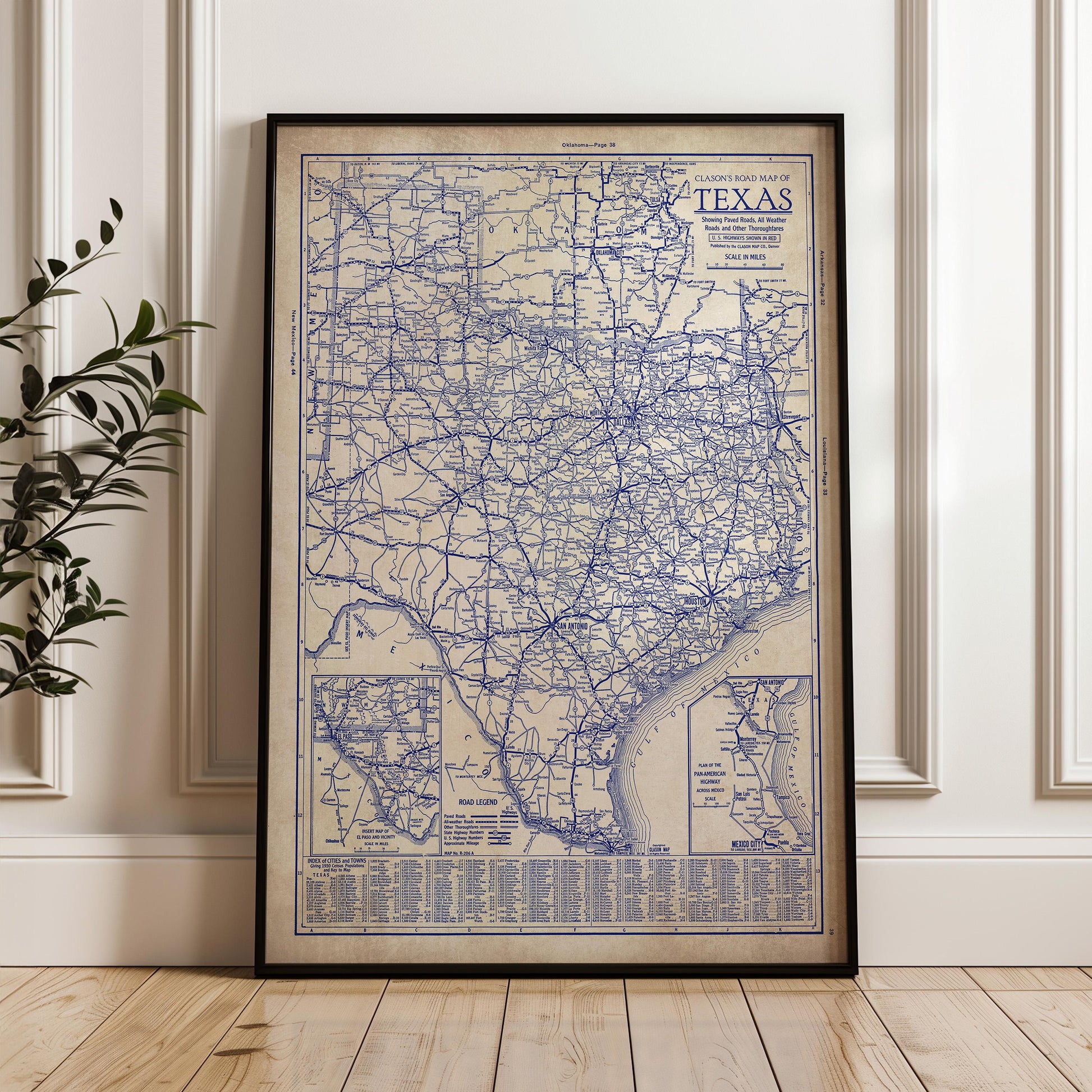 a framed vintage map of Texas, with detailed road networks and labels.