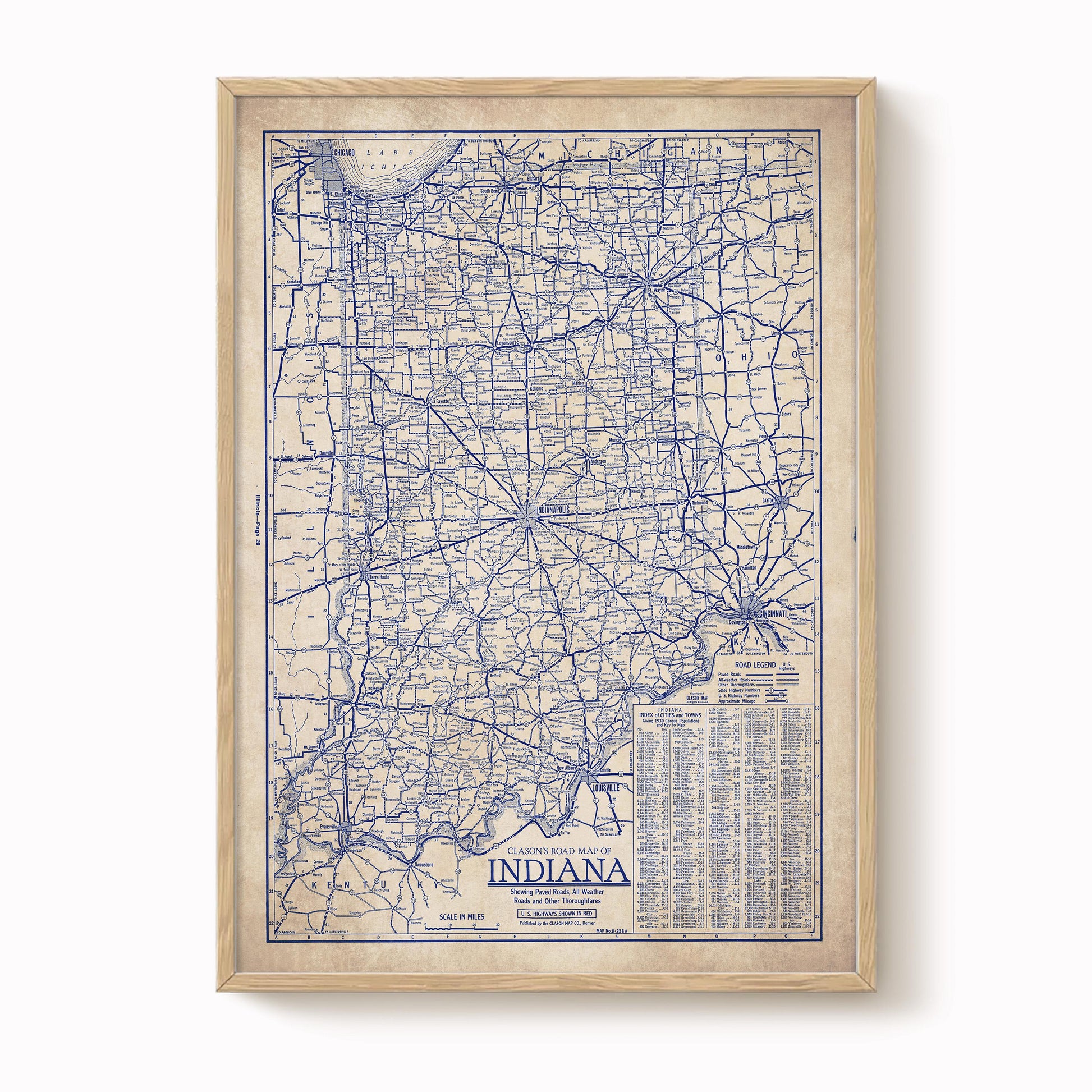 The image is a framed vintage map of Indiana, showing the state's roads and highways in a detailed and intricate manner.