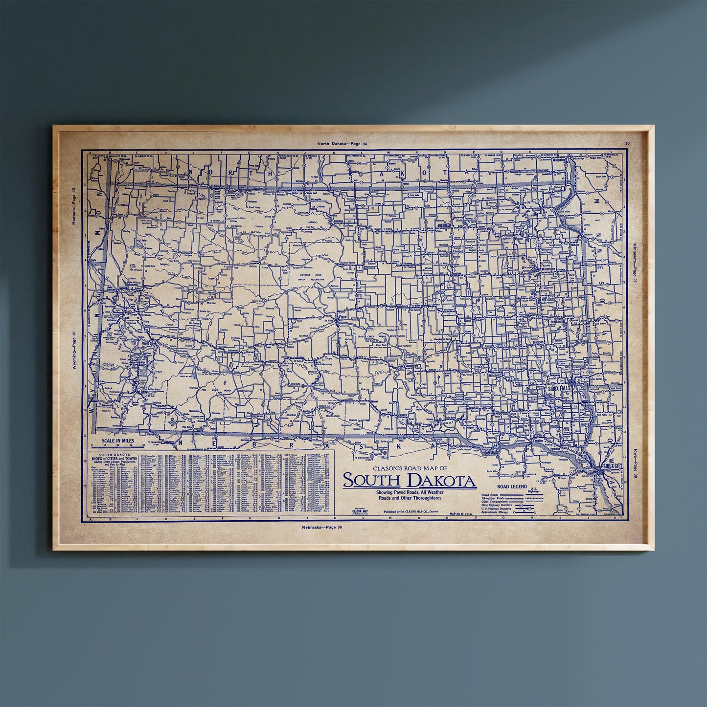 The image is a framed vintage map of South Dakota, showing the state's roads and highways in a detailed and detailed manner.
