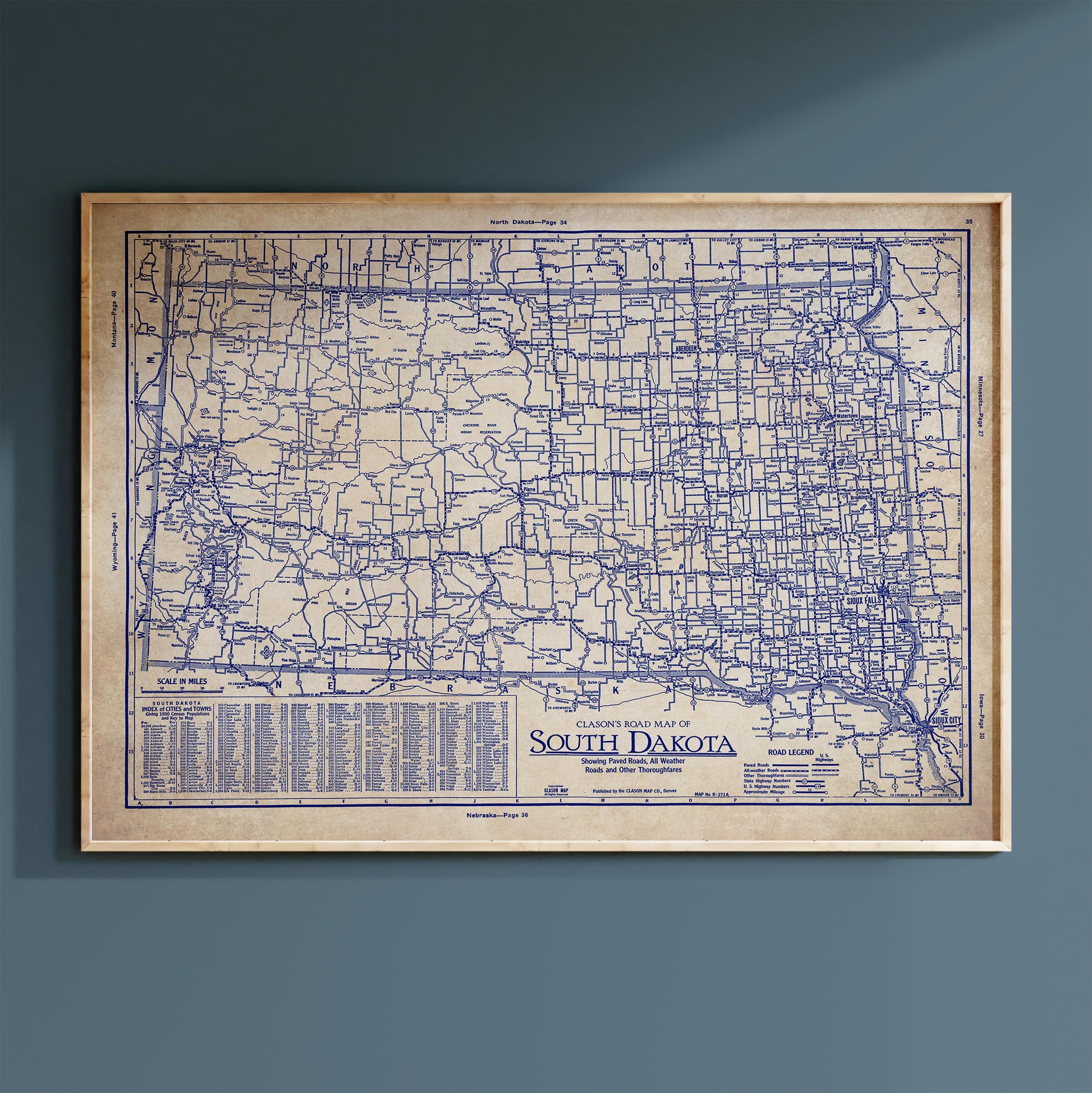 The image is a framed vintage map of South Dakota, showing the state's roads and highways in a detailed and detailed manner.