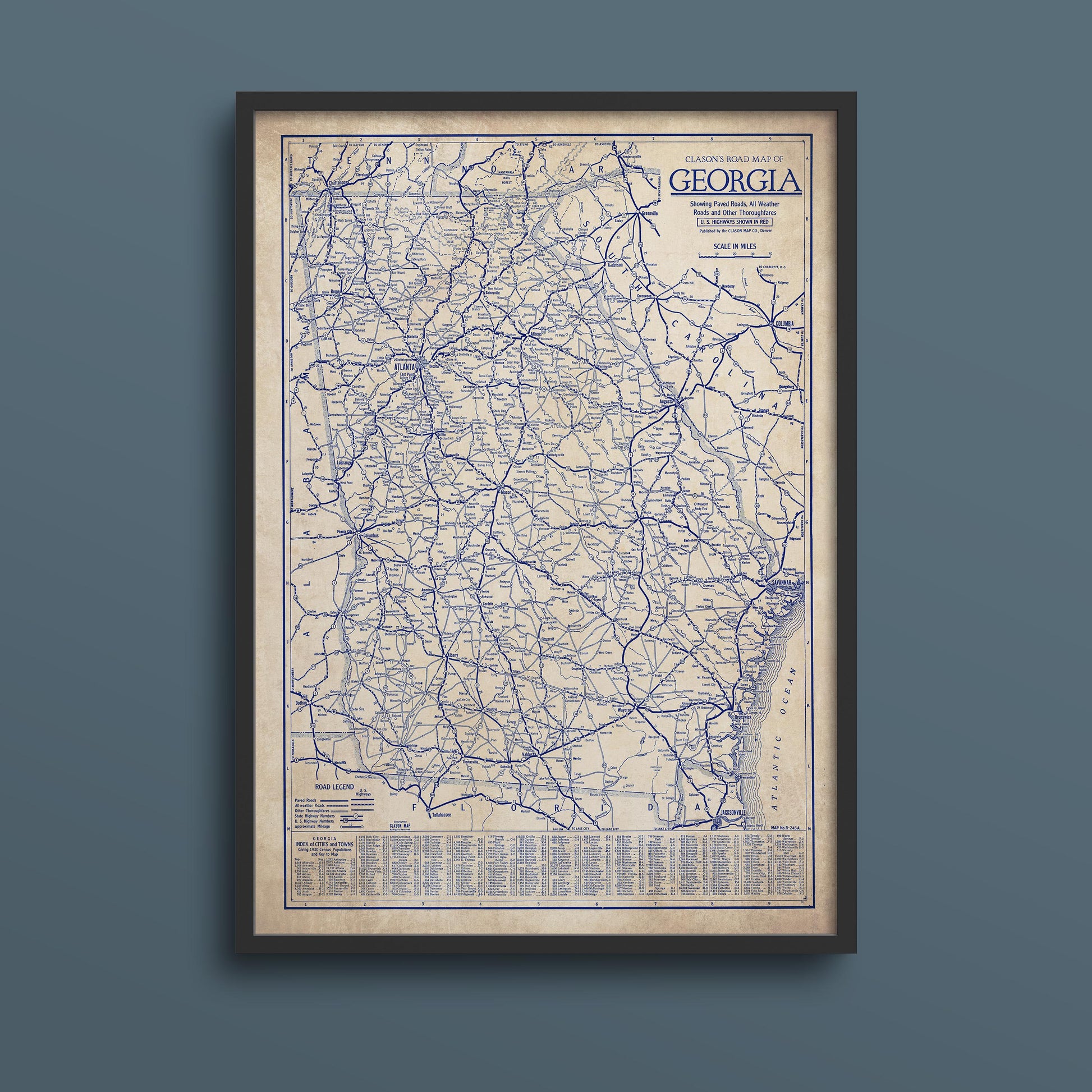 The image is a framed vintage map of Georgia, showing the state's roads and highways in blue and white.