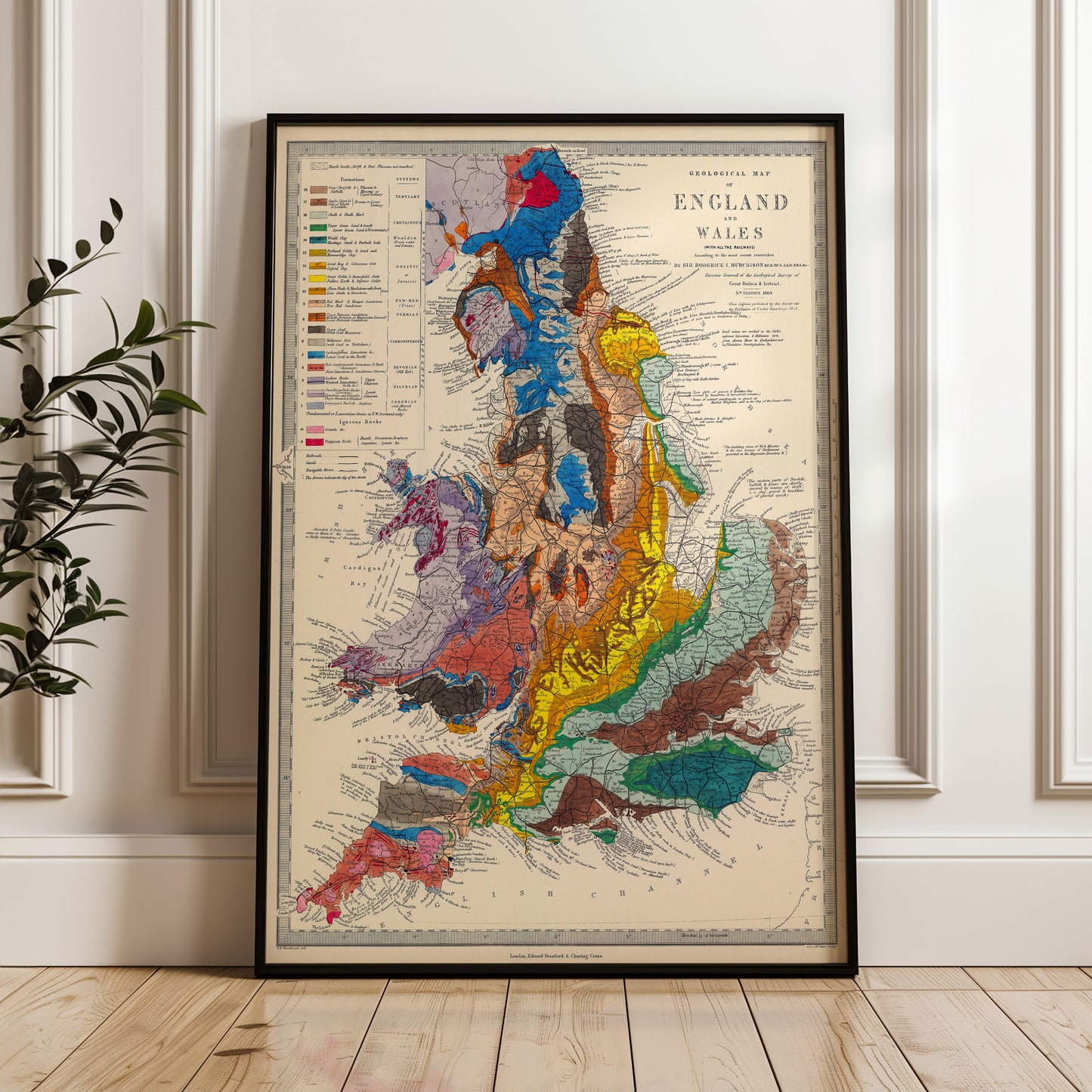 The image is a framed geological map of England, Wales, and Scotland, depicting the various geological features and regions of the United Kingdom.