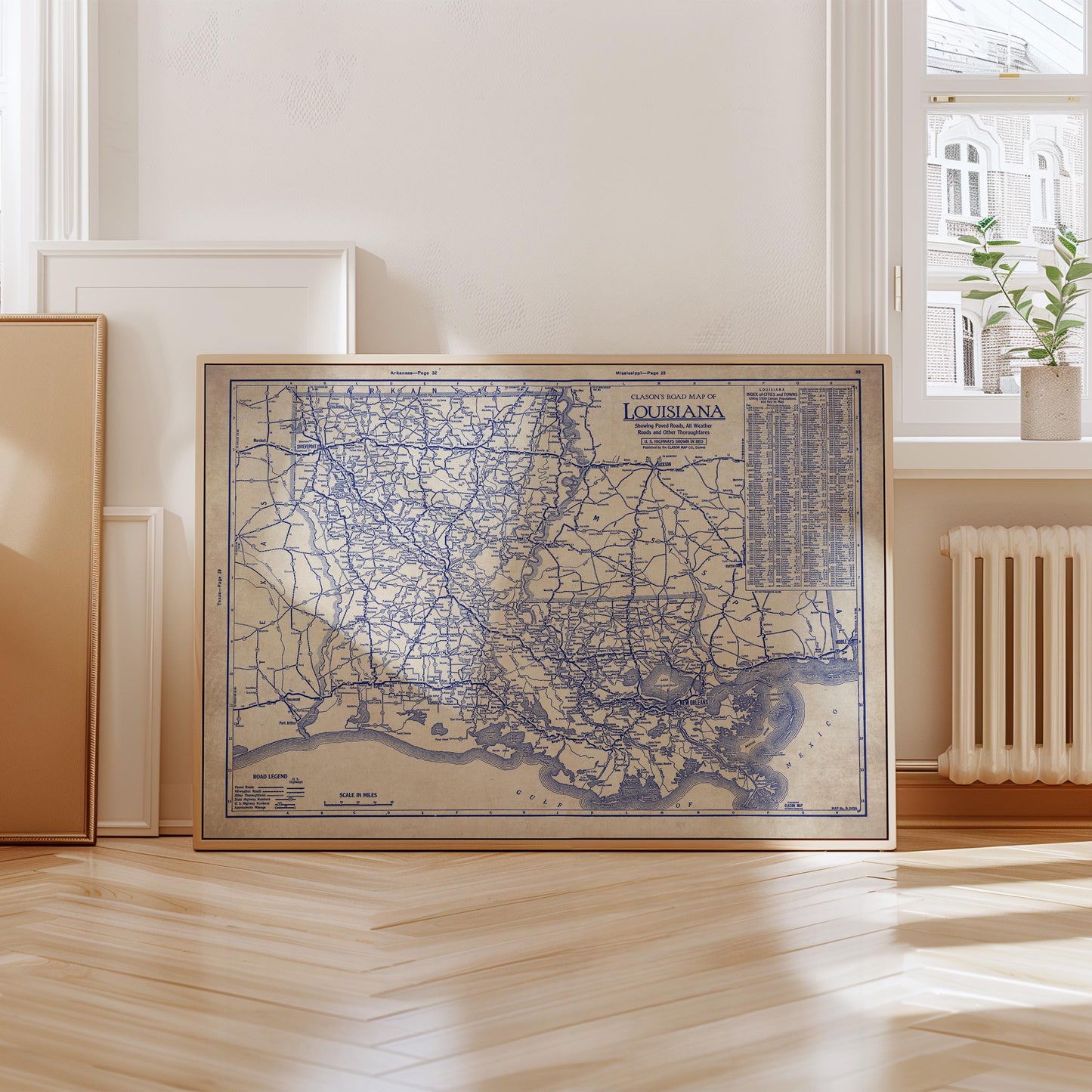 a framed map of Louisiana, with a vintage blue and white color scheme.