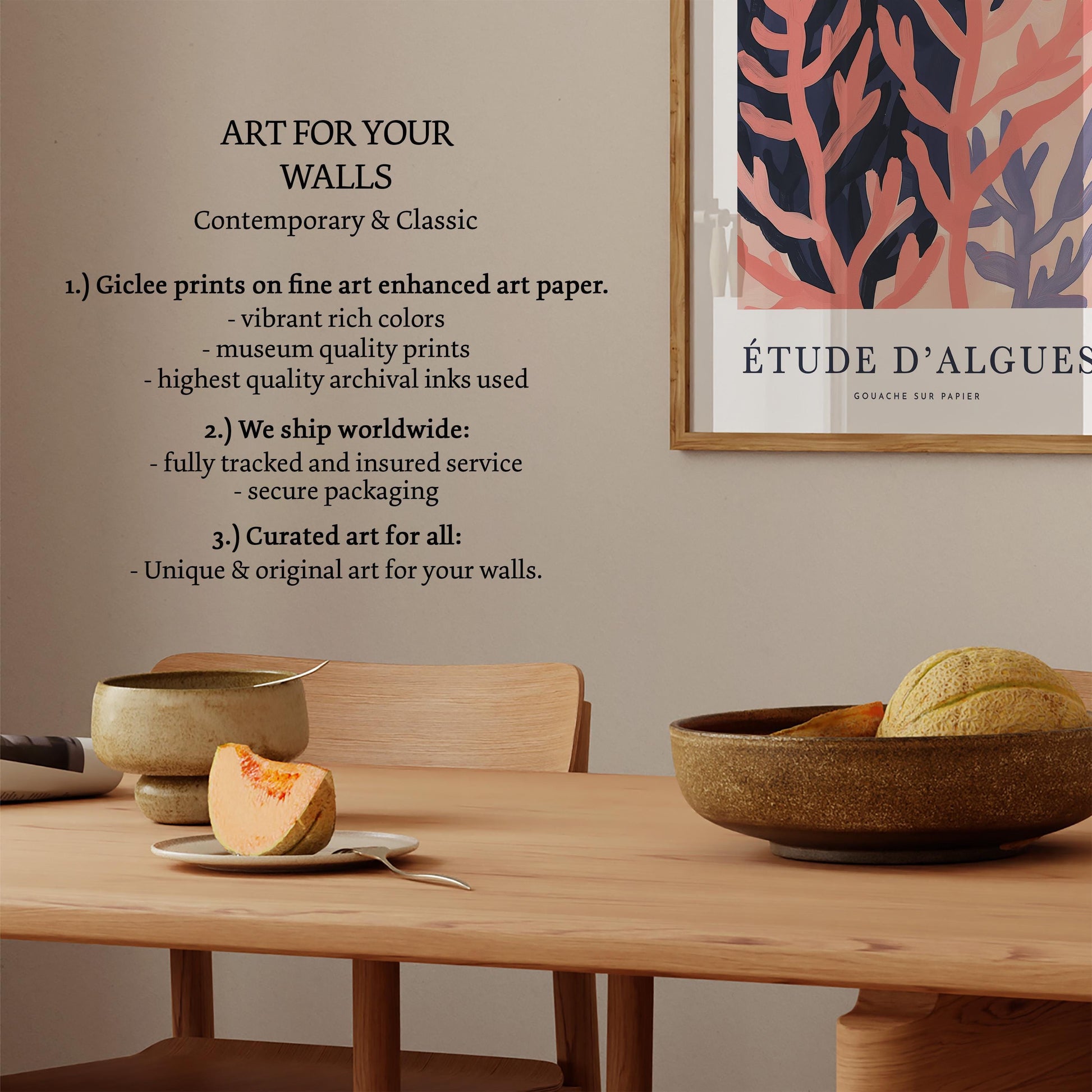 a wooden dining table with a bowl of fruit, a plate with a slice of fruit, and a framed poster on the wall.