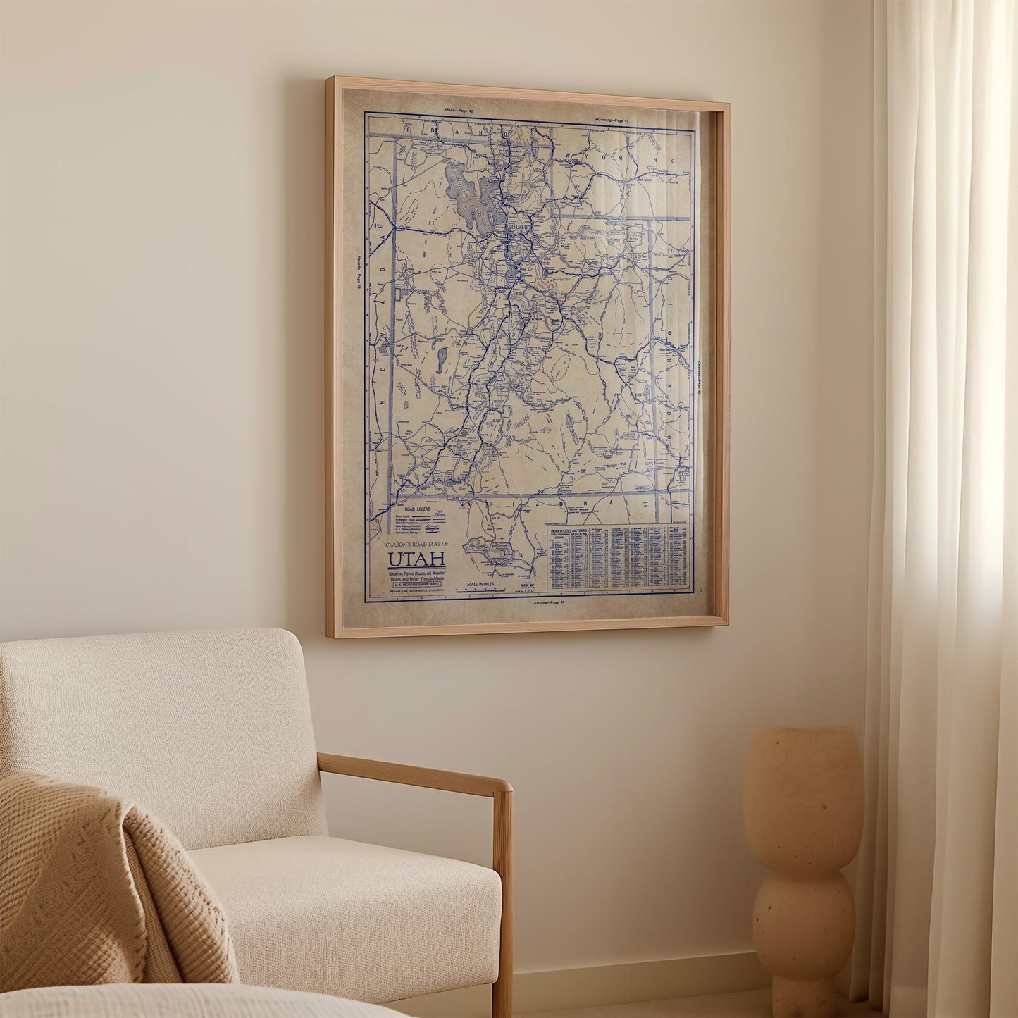 a framed map of Utah hanging on a wall in a room.