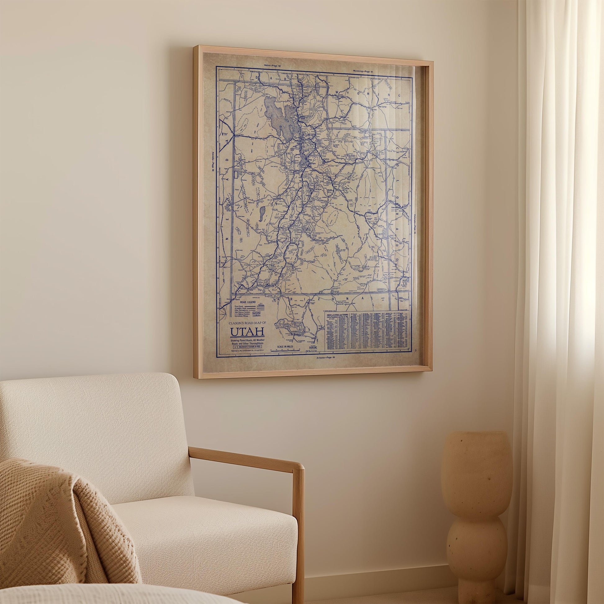 a framed map of Utah hanging on a wall in a room.
