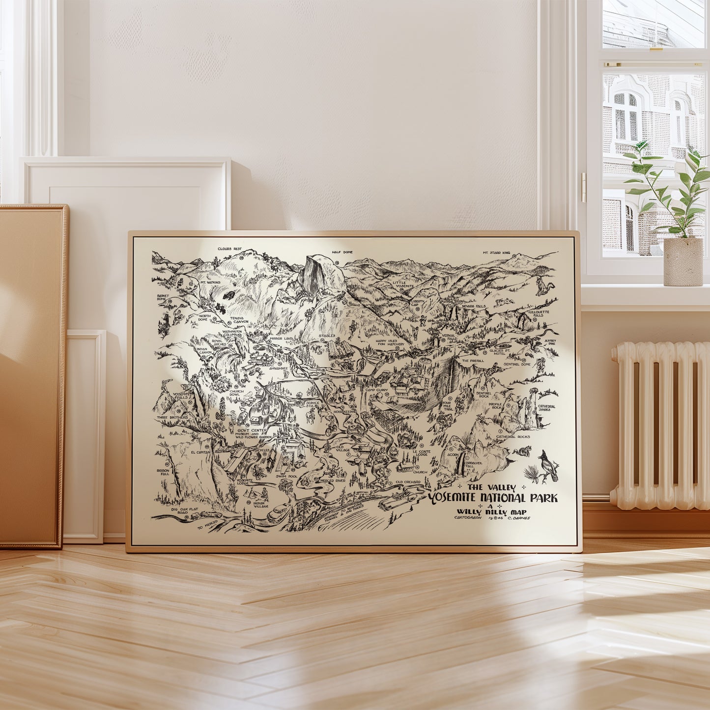 A framed map of the Yosemite National Park region, depicting various landmarks and natural features.