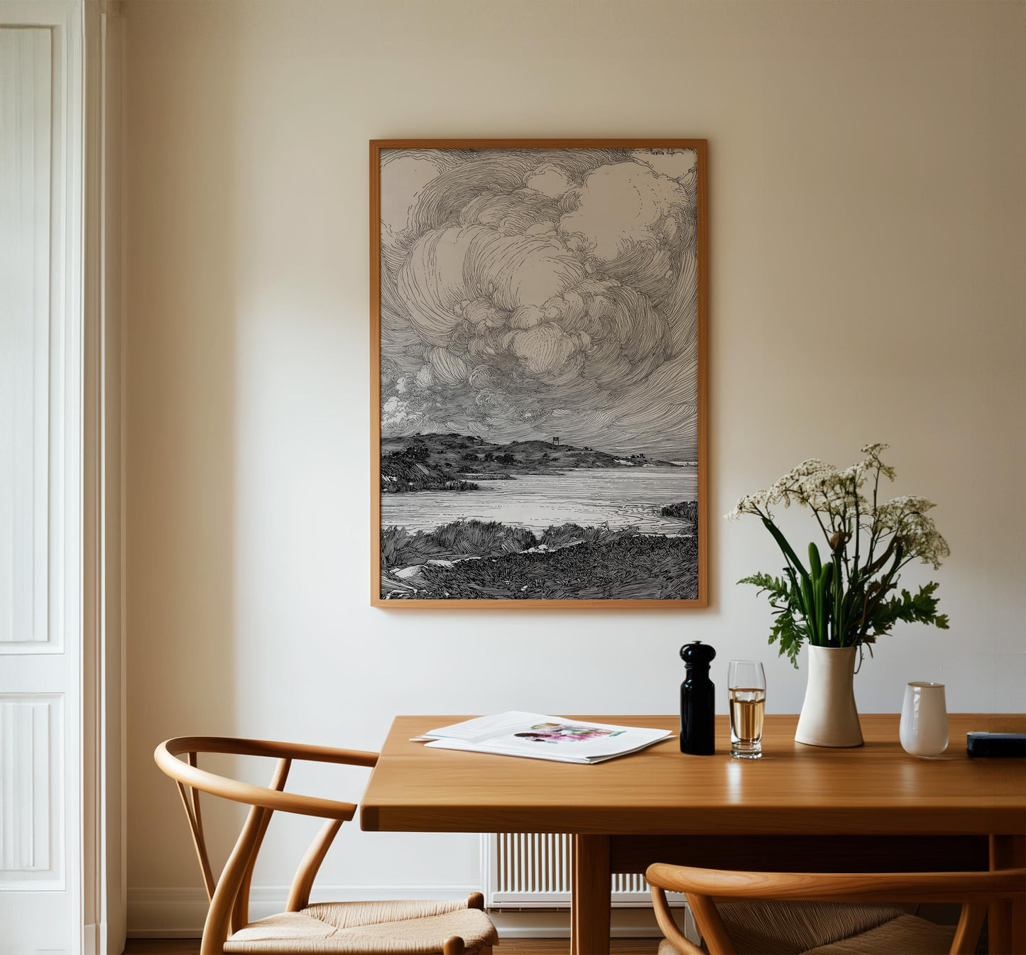 a serene indoor setting with a wooden dining table, two chairs, a framed landscape drawing on the wall, and a vase of flowers on the table.