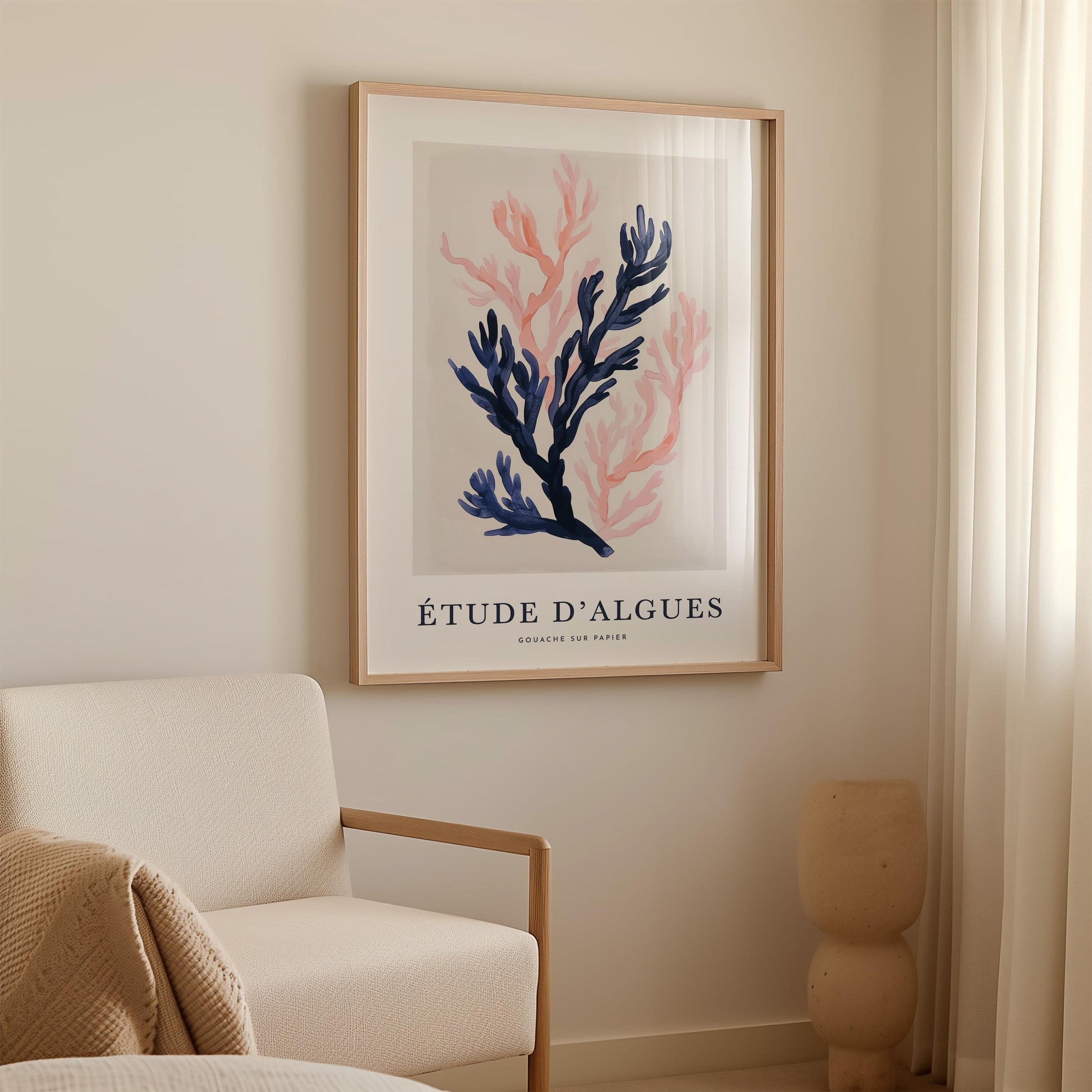 a framed artwork of a coral plant hanging on a wall in a living room.