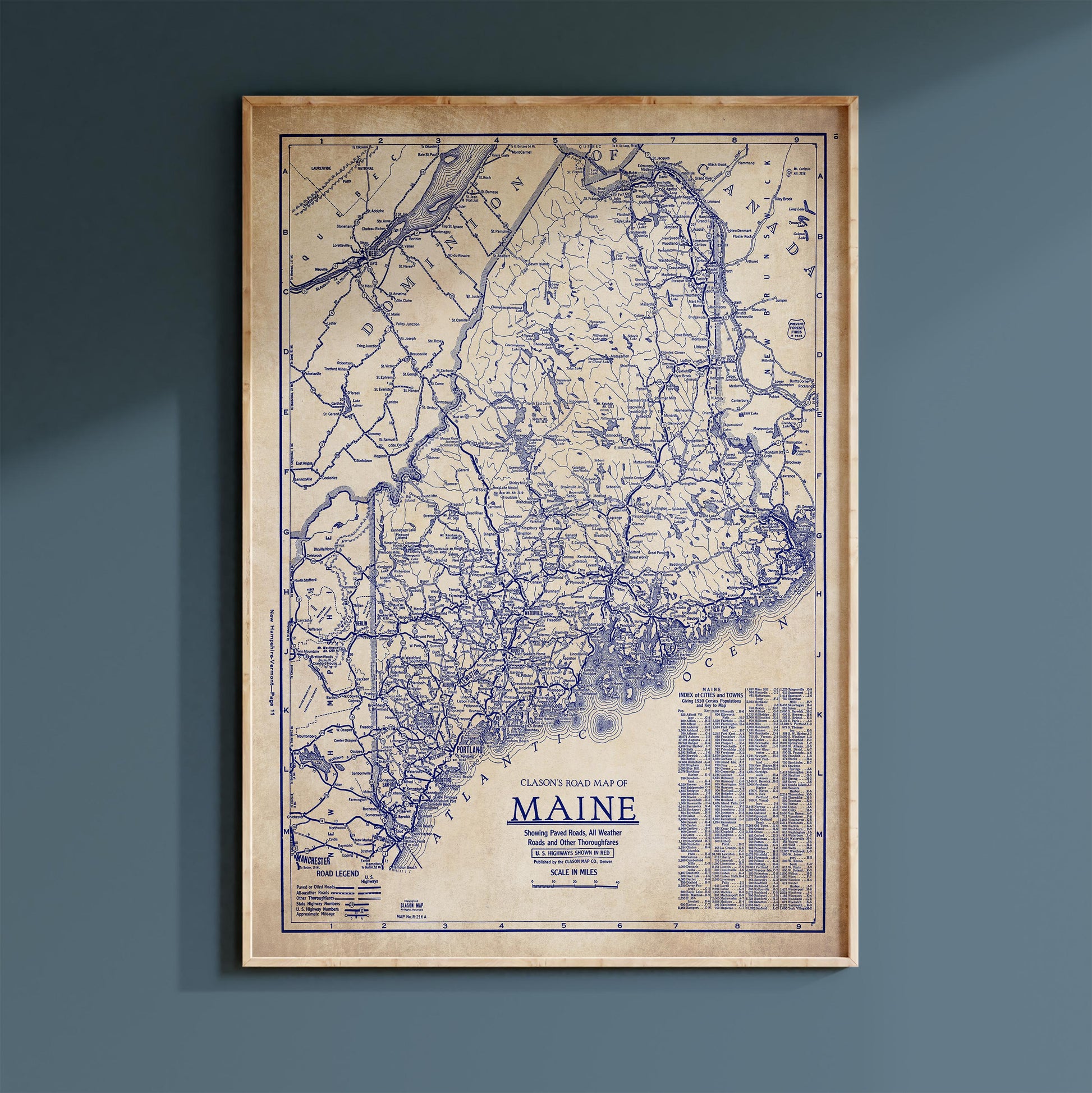 The image is a framed vintage map of Maine, showing the state's roads and highways in a detailed and detailed manner.