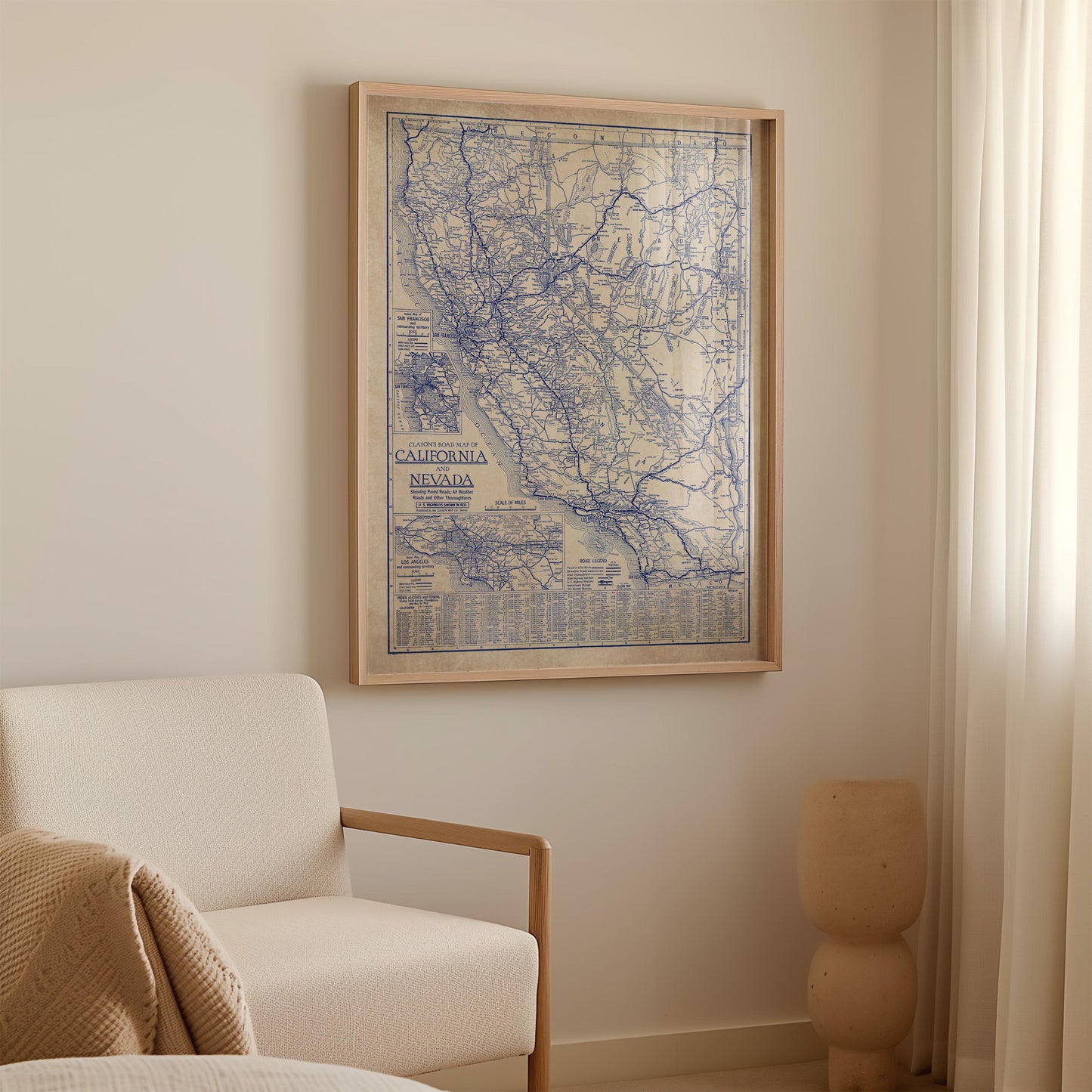 a framed map of California hanging on a wall in a room.