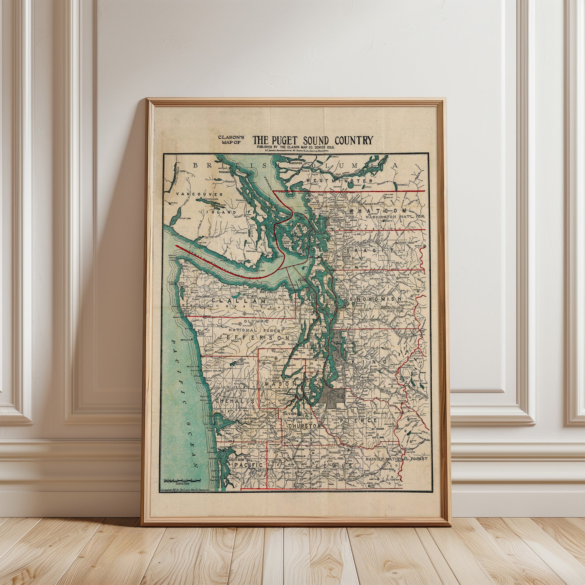 The image is a framed vintage map of the Puget Sound region in Washington, USA, depicting the area in a detailed and colorful manner.