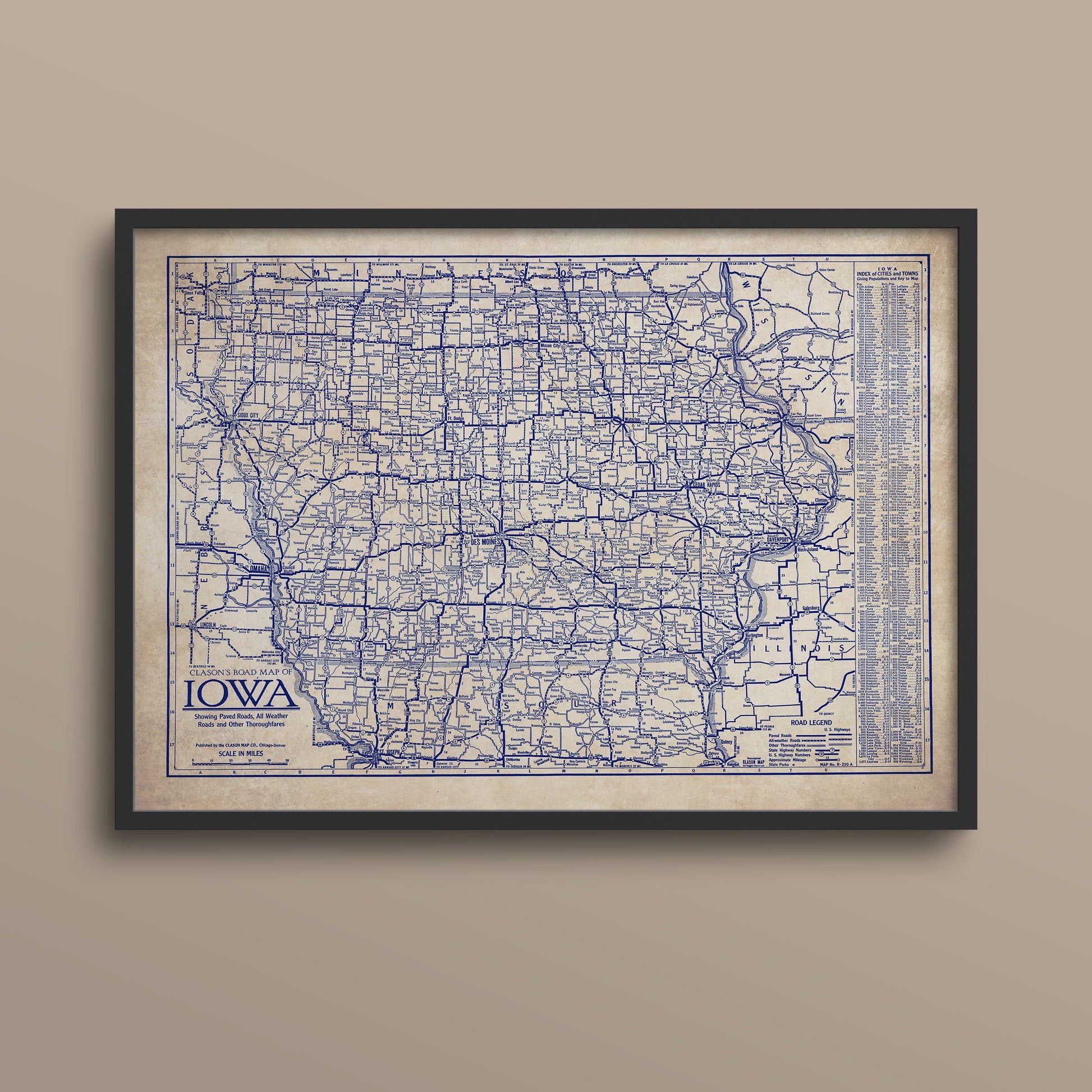 The image is a framed vintage map of Iowa, showing the state's roads and highways in a detailed and detailed manner.