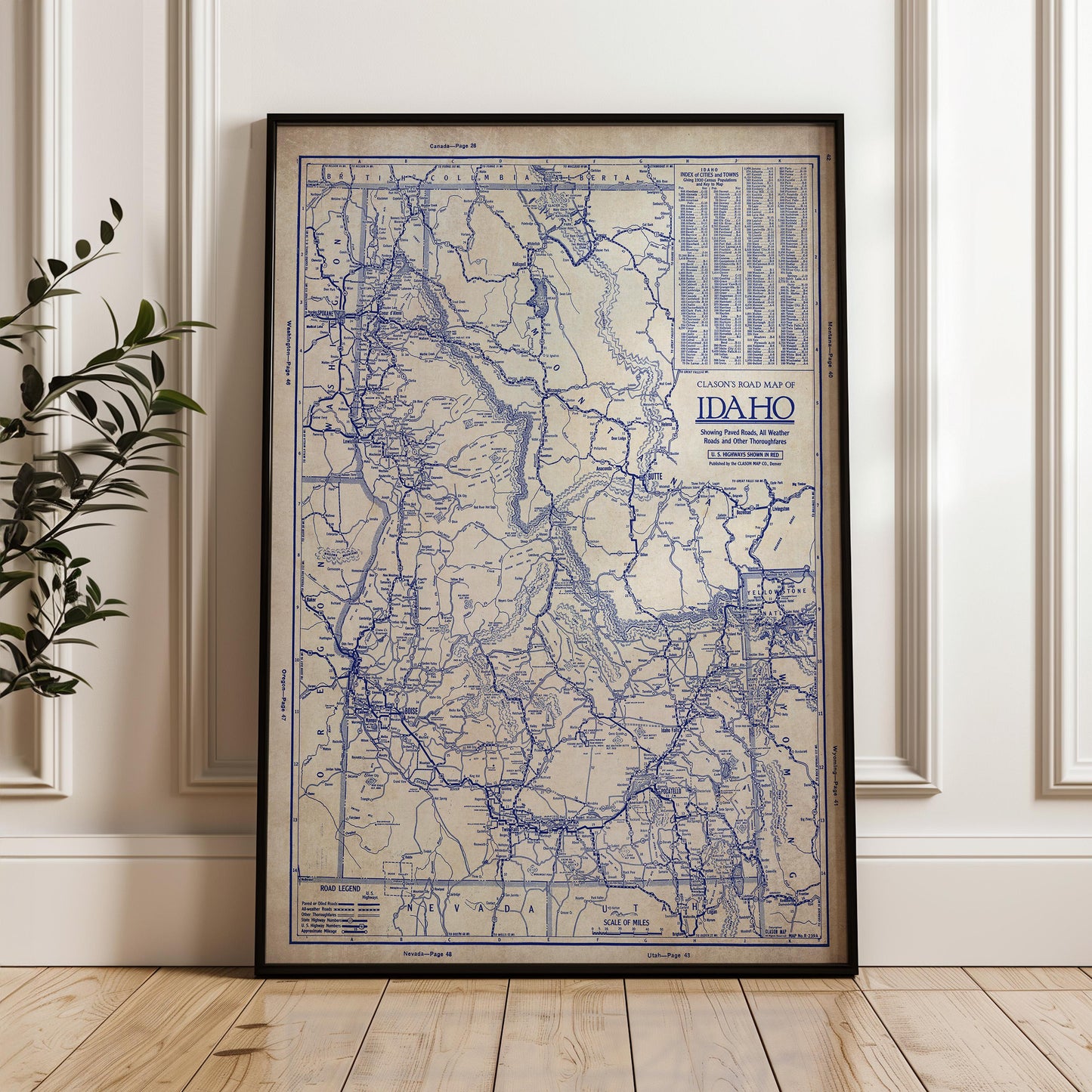 a framed map of Idaho, with a detailed and intricate blue and white color scheme.