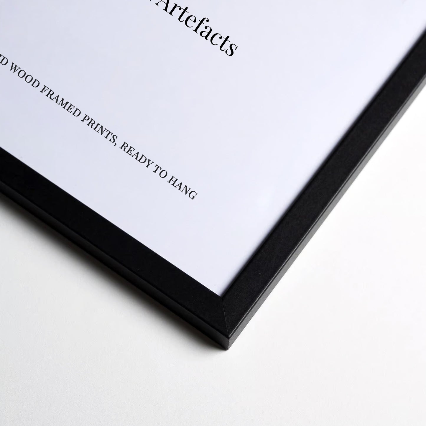 The image is a close-up of a black-framed picture with a white background.