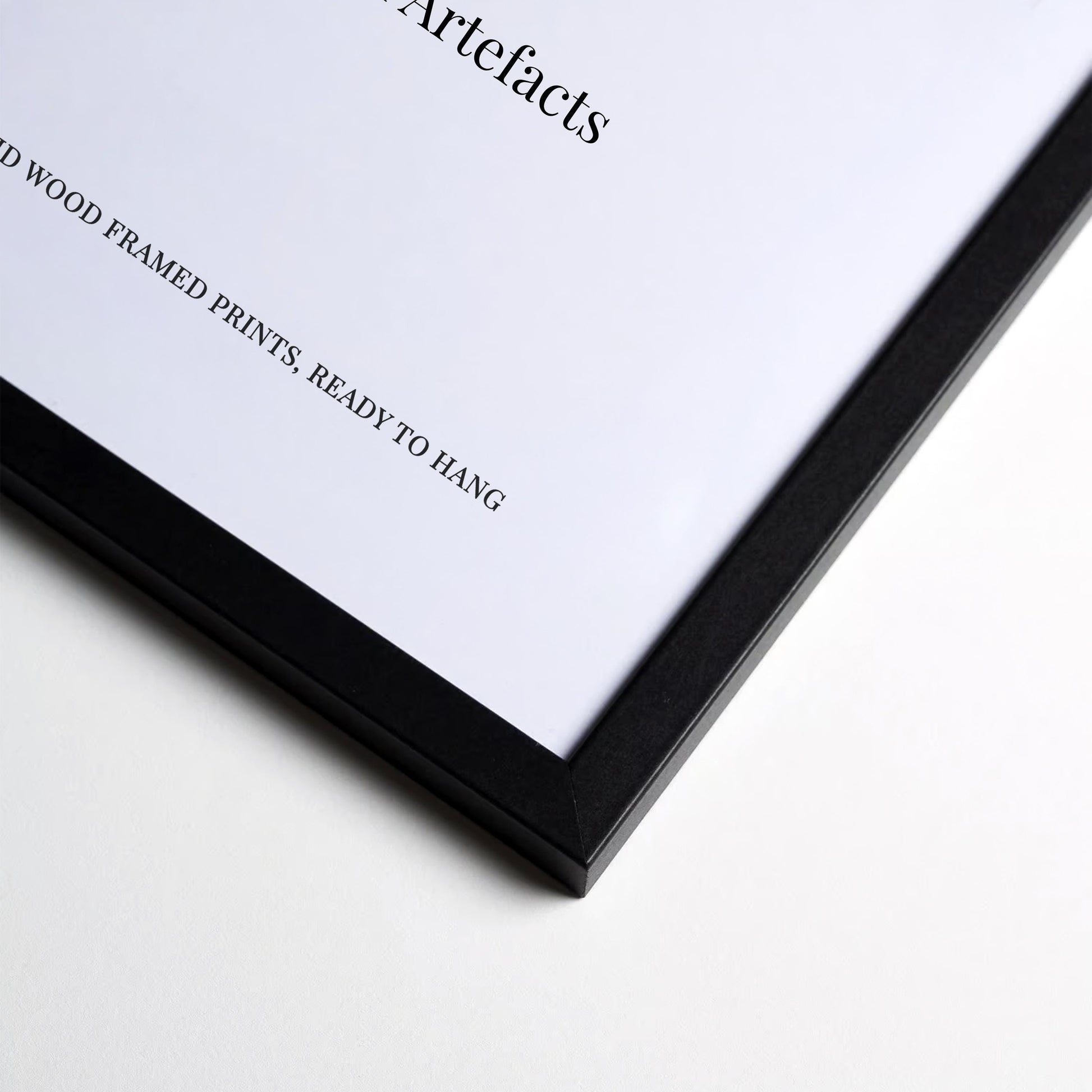 The image is a close-up of a black-framed picture with a white background.