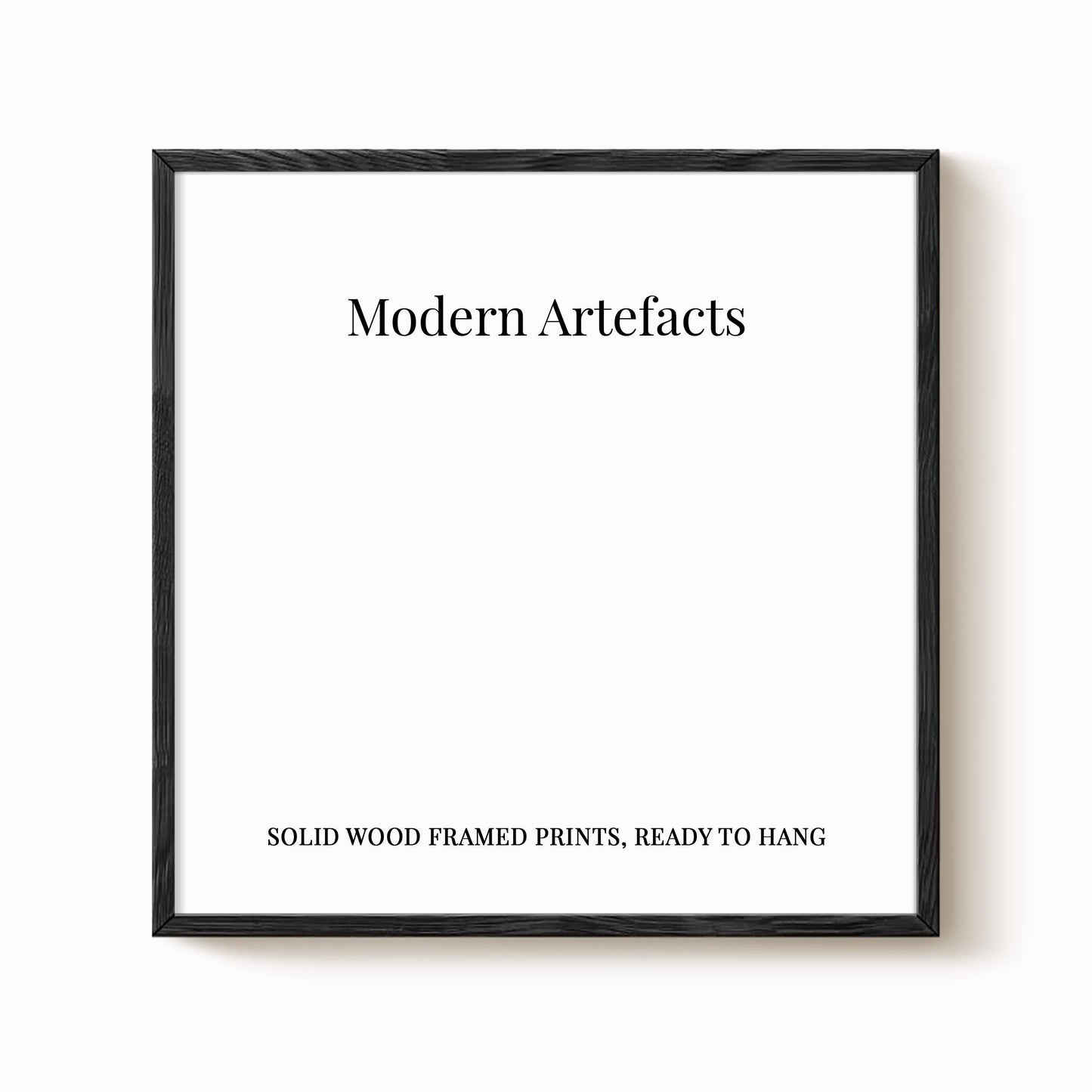The image is a square frame with the text "Modern Artifacts" written in black at the top. Below the text, it says "SOLID WOOD FRAMED PRINTS. READY TO HANG".
