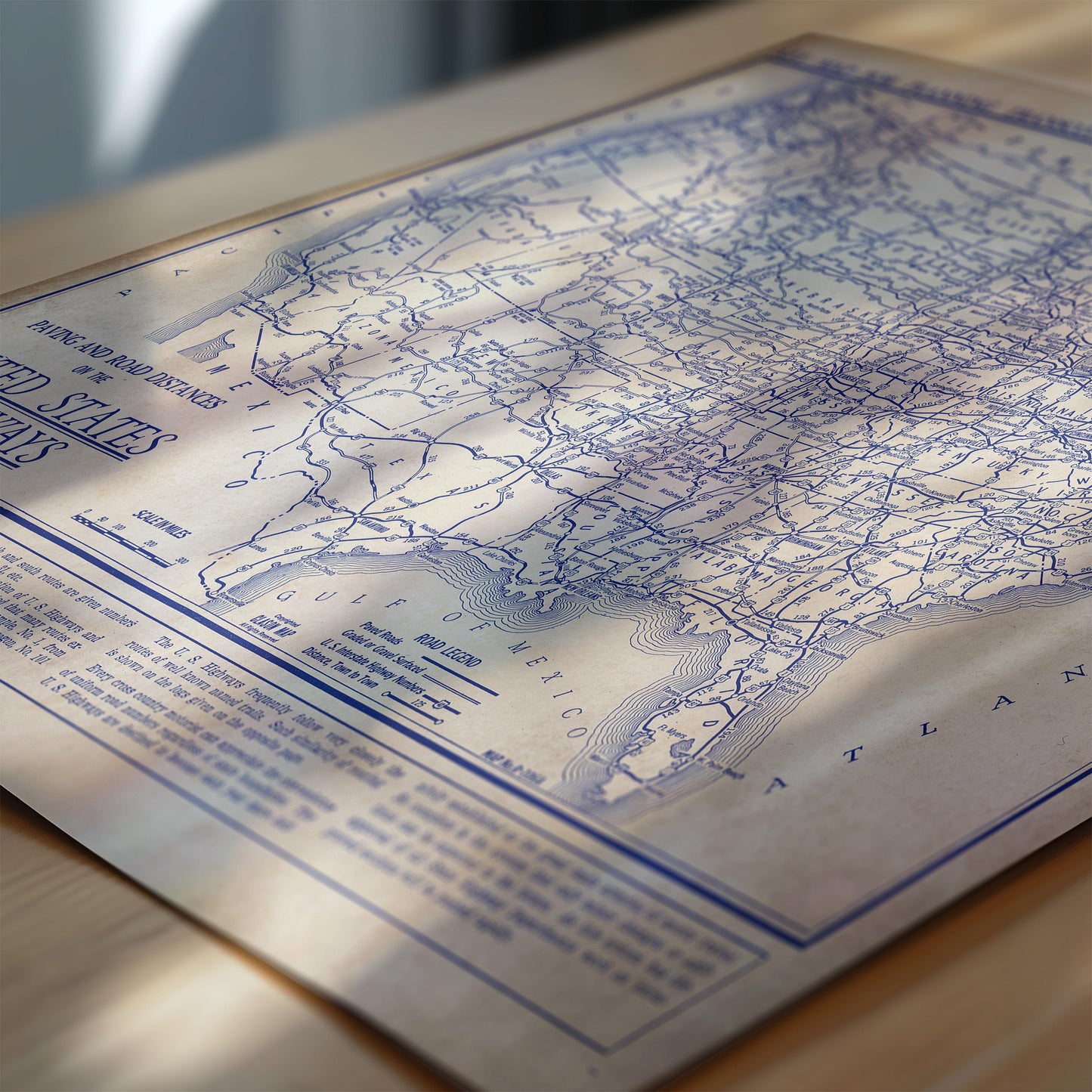 The image is a close-up of a map of the United States, showing the country's major cities and roads.