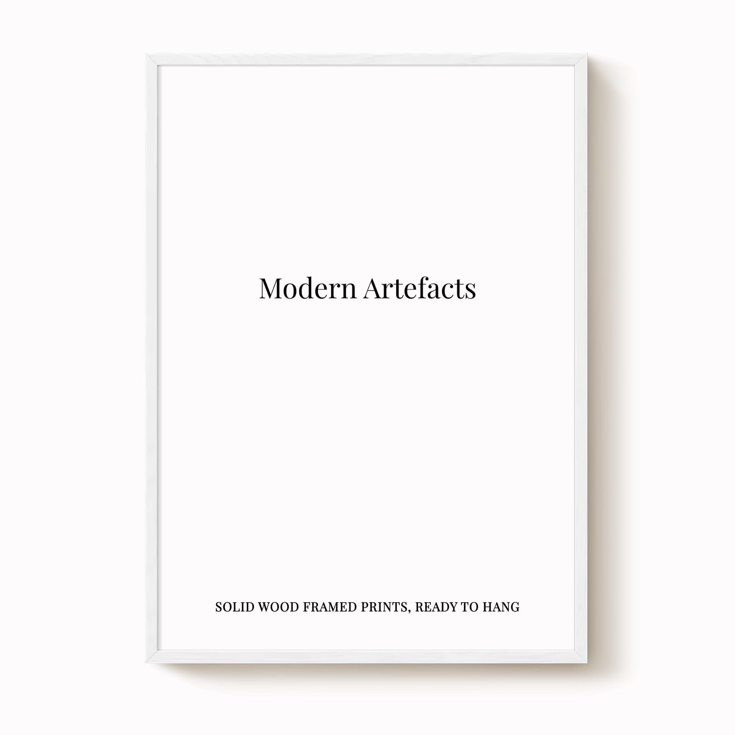 The image is a white framed print with the text "Modern Artifacts" and "SOLIDWOOD FRAMED PRINTS, READY TO HANG" printed on it.