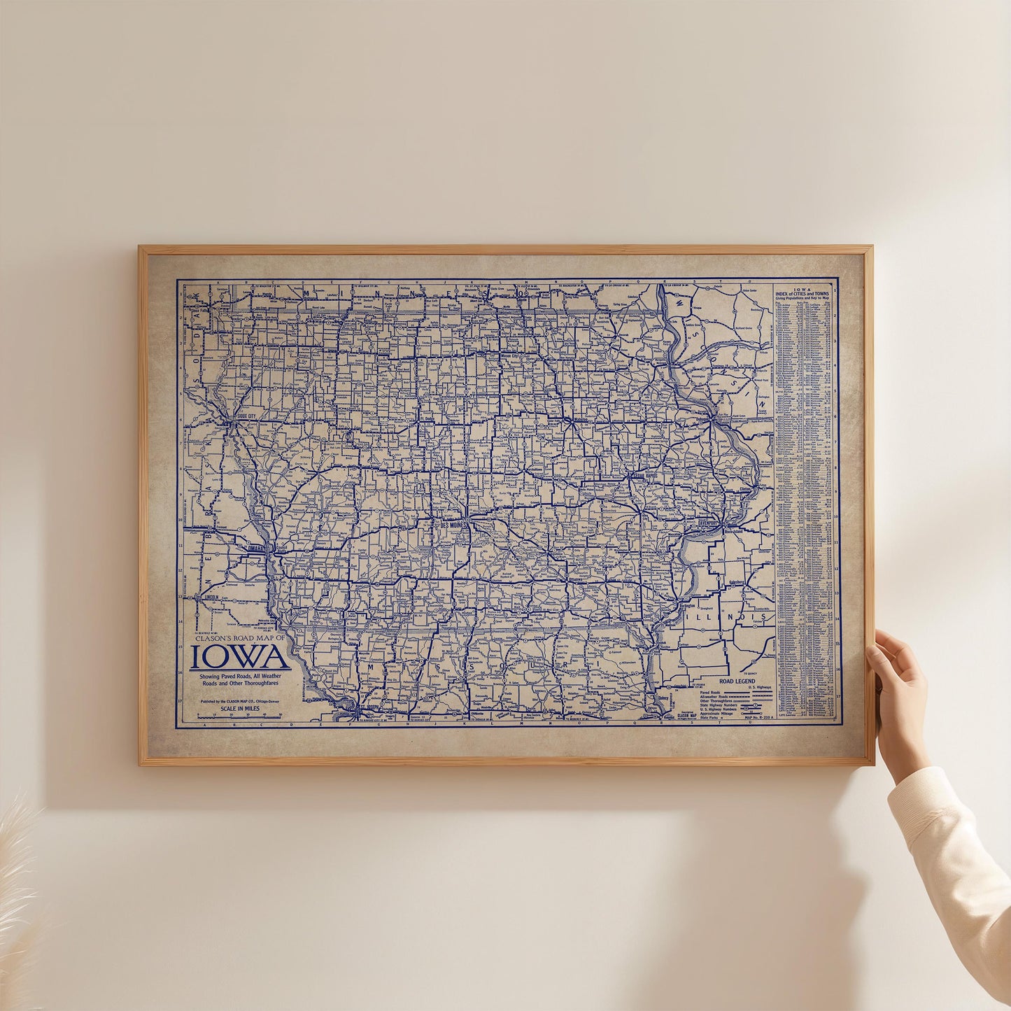 A framed map of Iowa, with the state's roads and highways clearly visible.