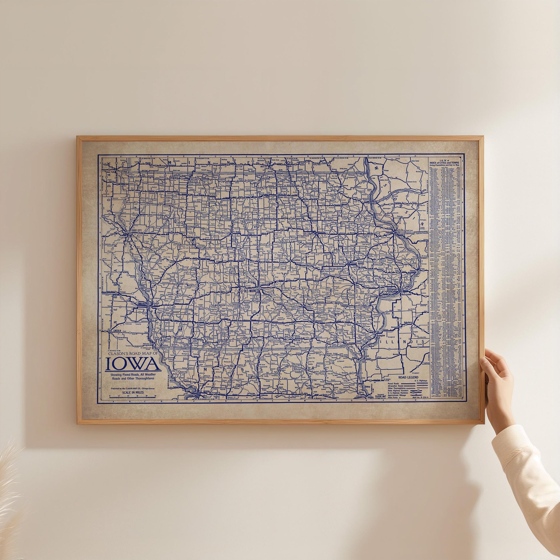 A framed map of Iowa, with the state's roads and highways clearly visible.