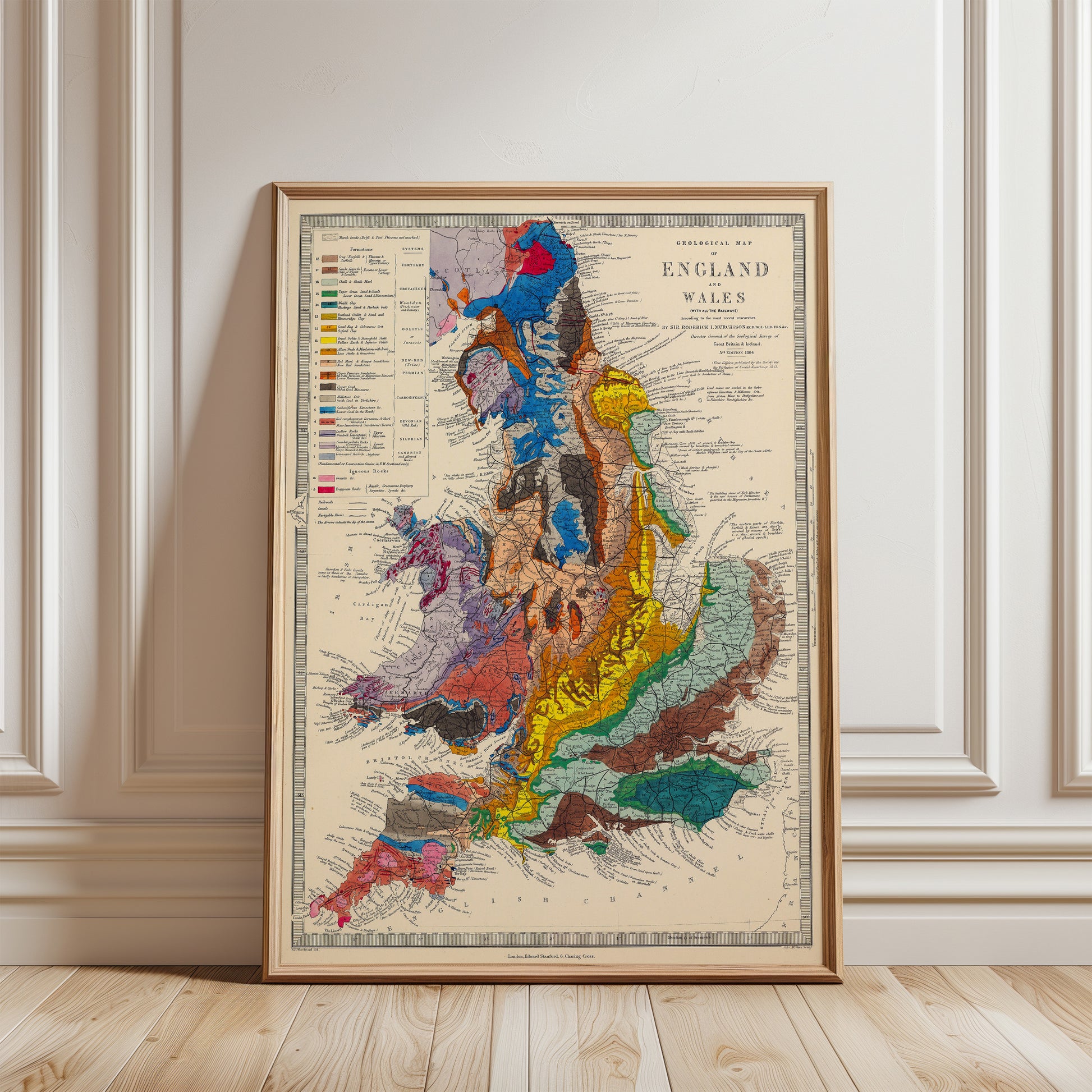 The image is a framed geological map of England and Wales, showing the various geological features and regions of the country.