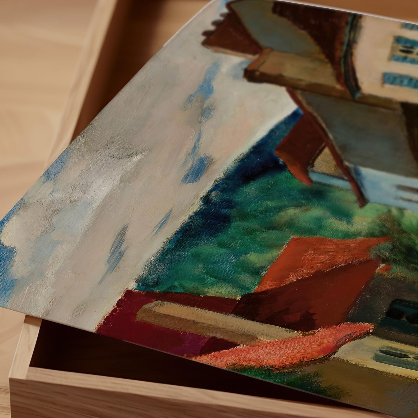 The image is a close-up of a painting on a wooden surface, featuring a colorful abstract composition with various shapes and textures.