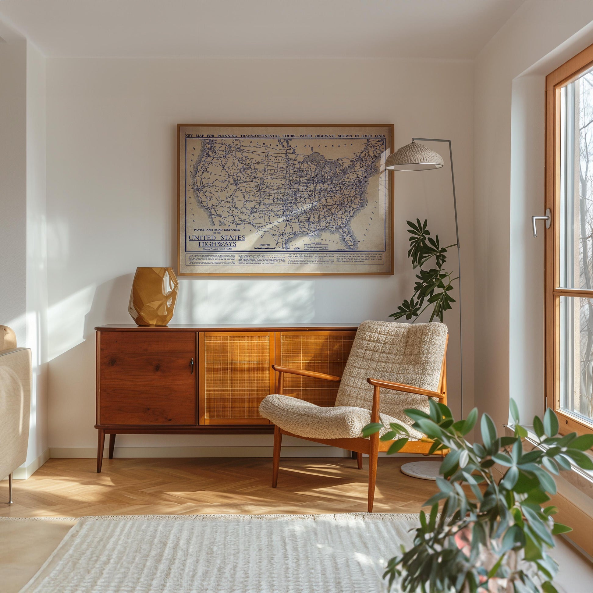 a cozy living room with a large map of the United States on the wall, a wooden cabinet, a beige armchair, and a potted plant.