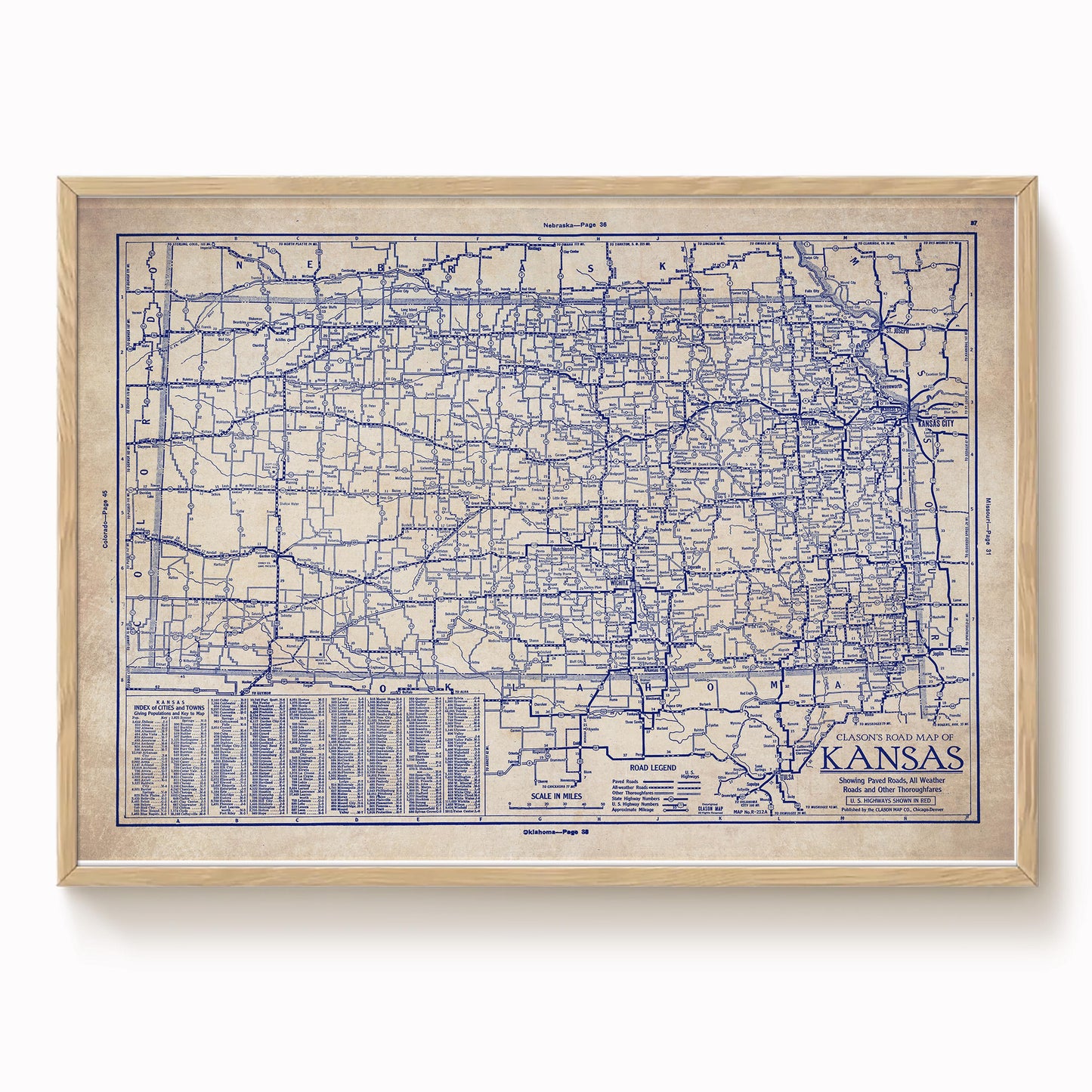 The image is a framed vintage map of Kansas, showing the state's roads and highways in a detailed and intricate manner.