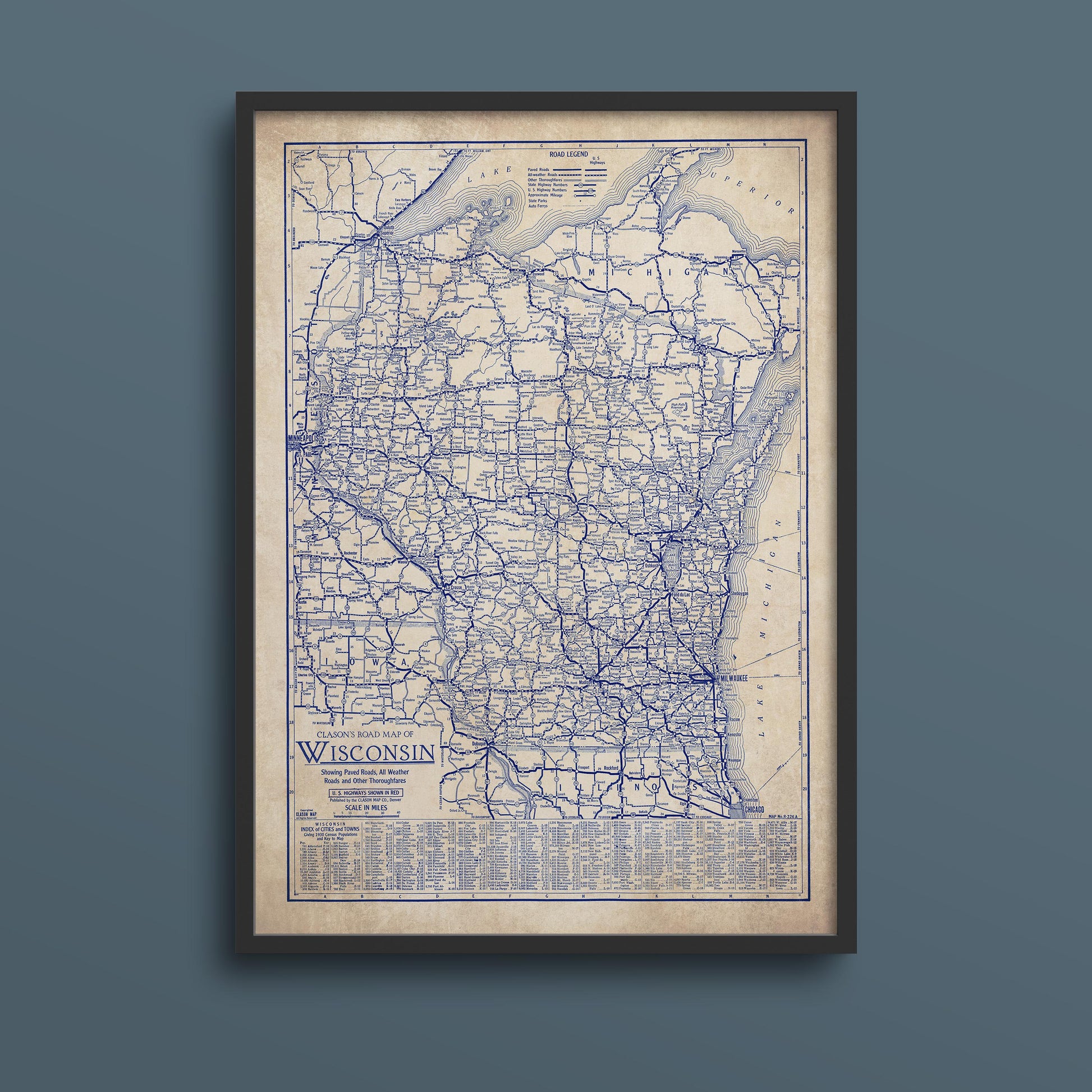 The image is a framed vintage map of Wisconsin, showing the state's roads and highways in blue.