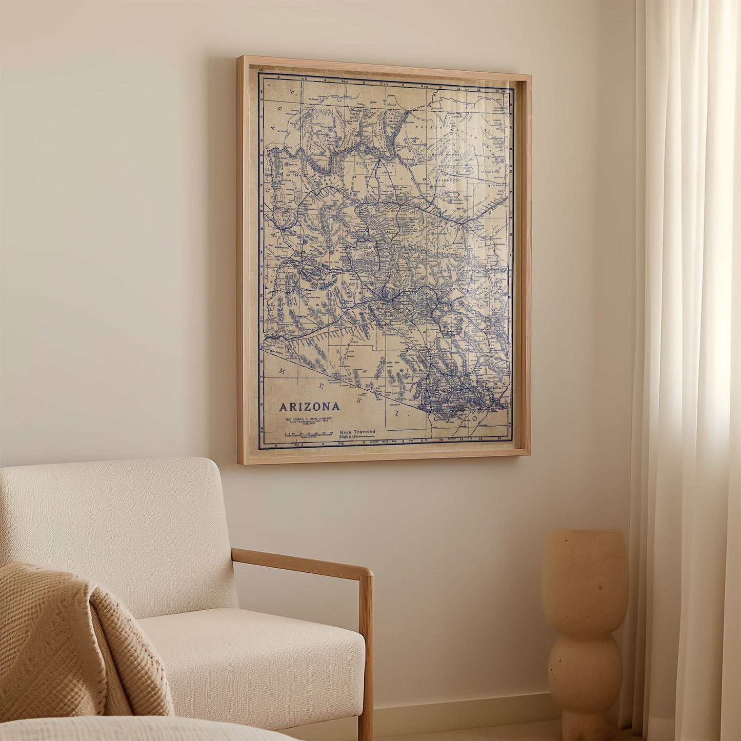 a framed map of Arizona hanging on a wall in a room.