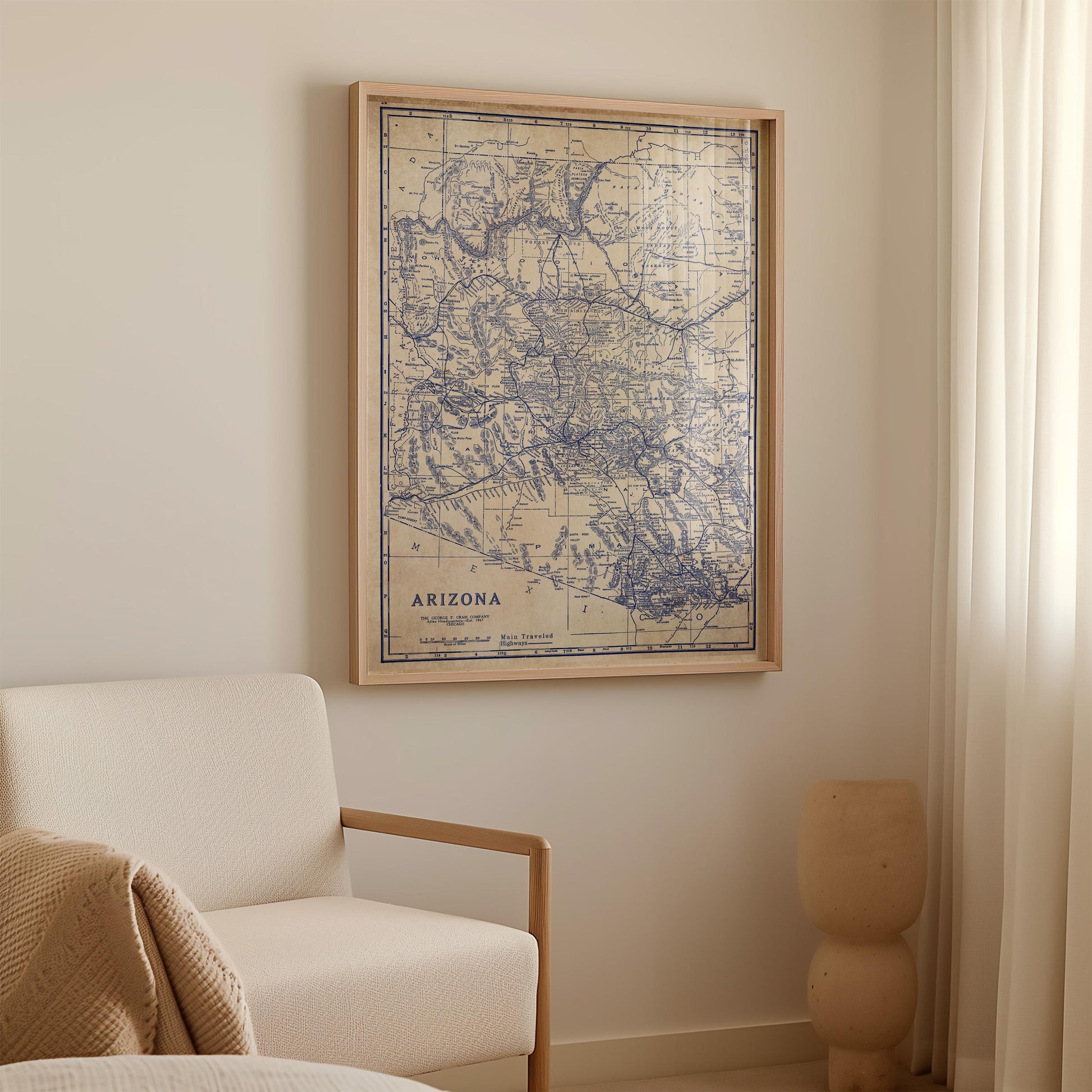 a framed map of Arizona hanging on a wall in a room.